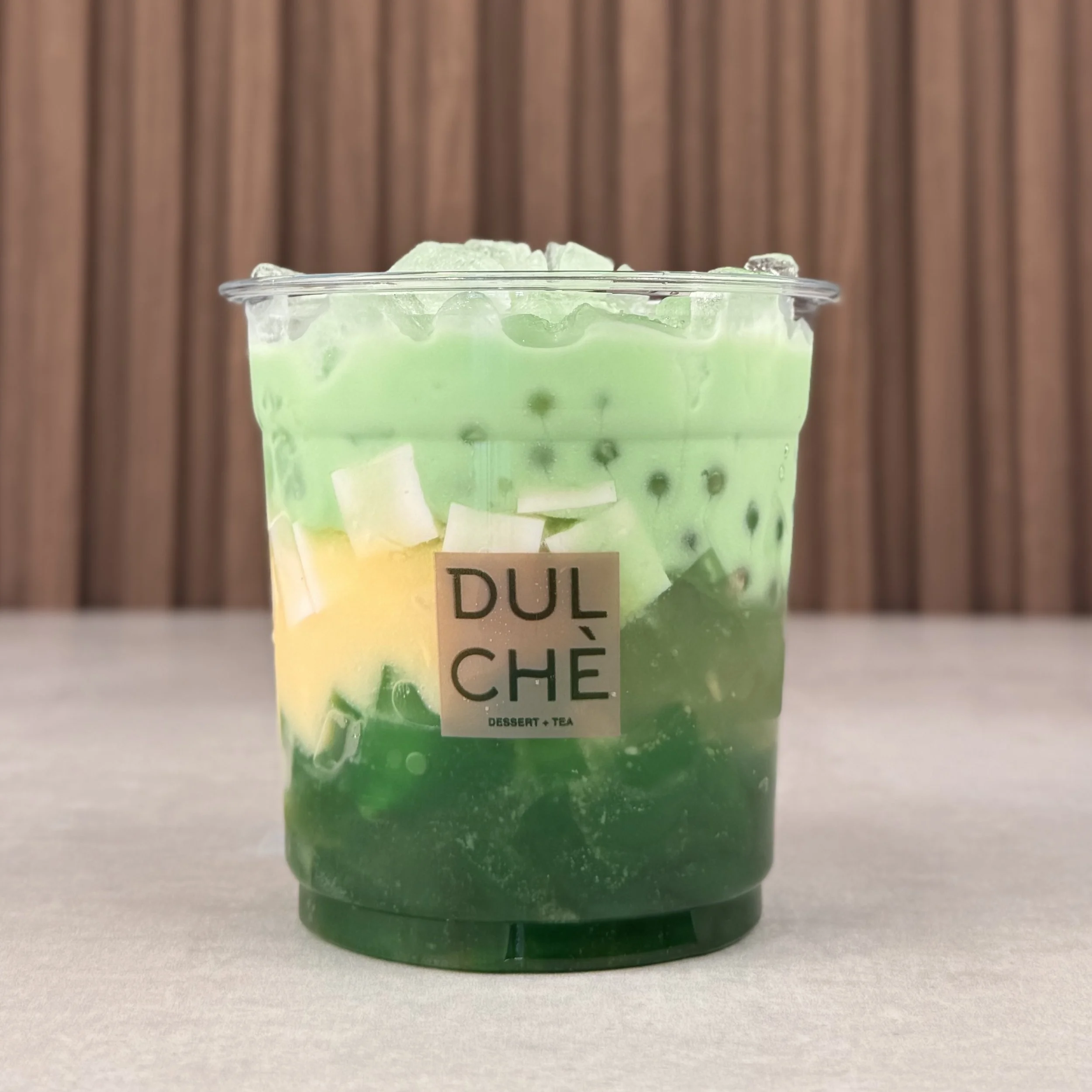 Pandan Coconut - Chè Dừa Sâm Dứa. 
Fan favorite for a reason. Creamy pandan milk layered with pandan and coconut jelly with a bit of mung bean paste. Light, fragrant, and just sweet enough. 