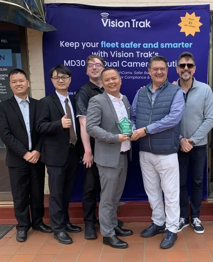 Staff Photo with the CEO of VisionTrak on the Right receiving an award