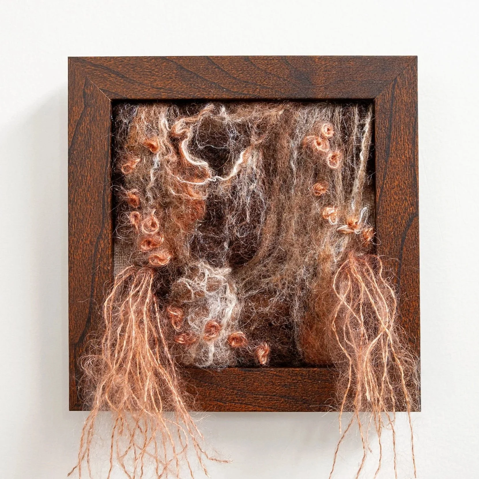 framed felted art inspired by fungi with brown and peach accents