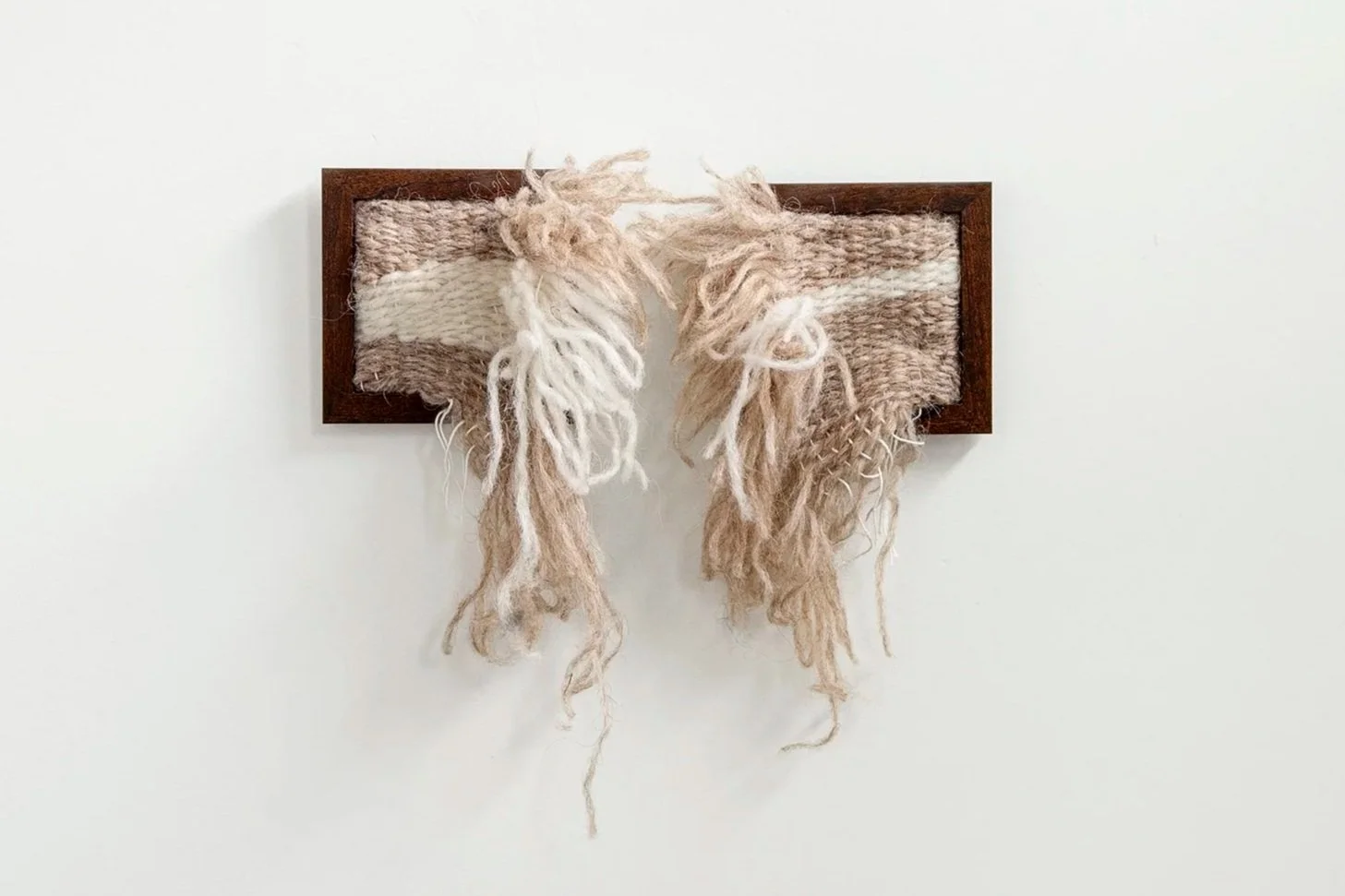 cream and white woven piece in two frames by artist lisa cox