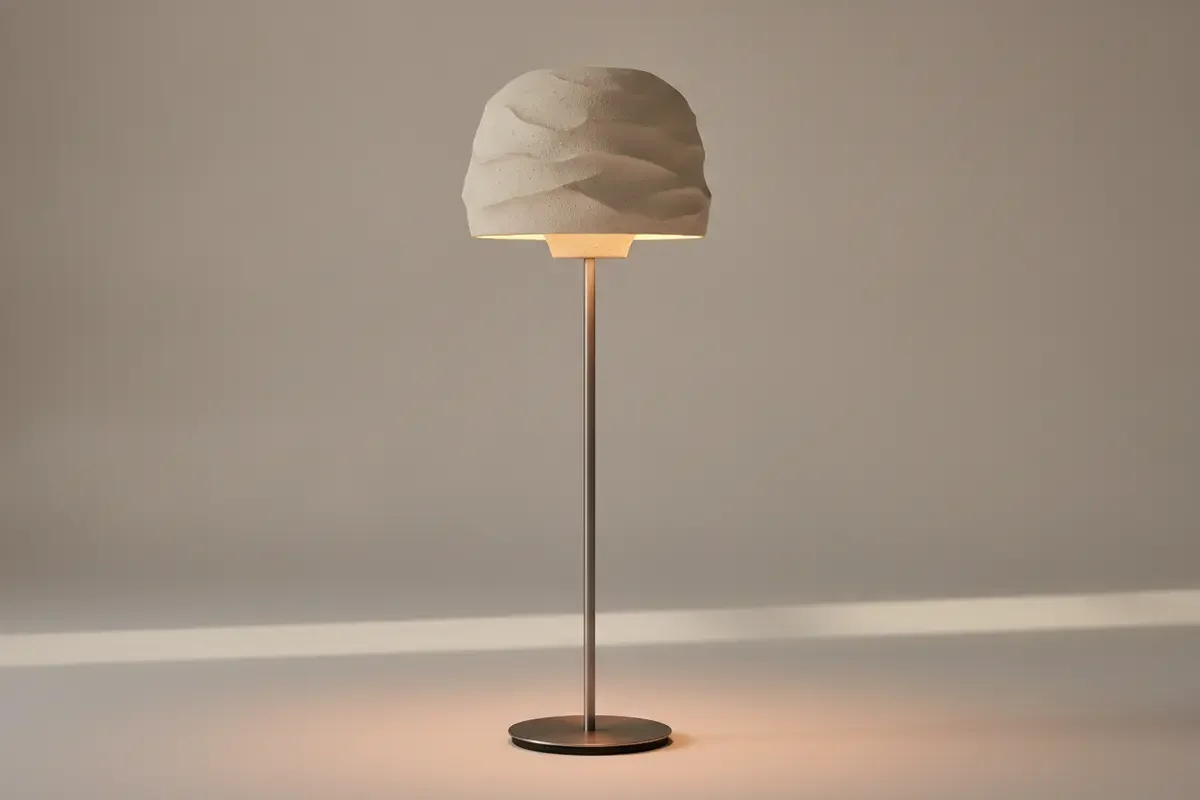 Close view of a ceramic shade and steel body on a contemporary floor lamp