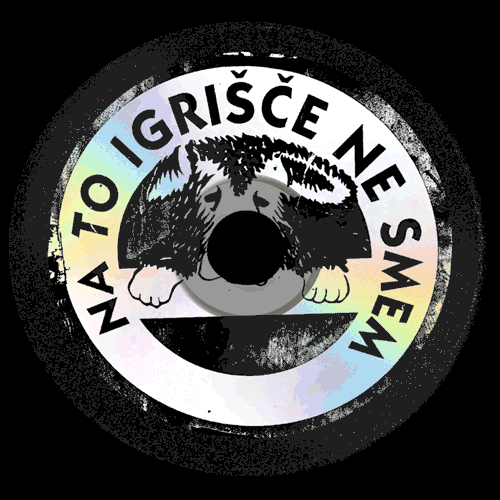 A circular sticker with a husky dog's face in the center, surrounded by the text 'NA TO IGRIŠČE NE SMEJ' in Slovene, which translates to 'You are not allowed to make a mess'.