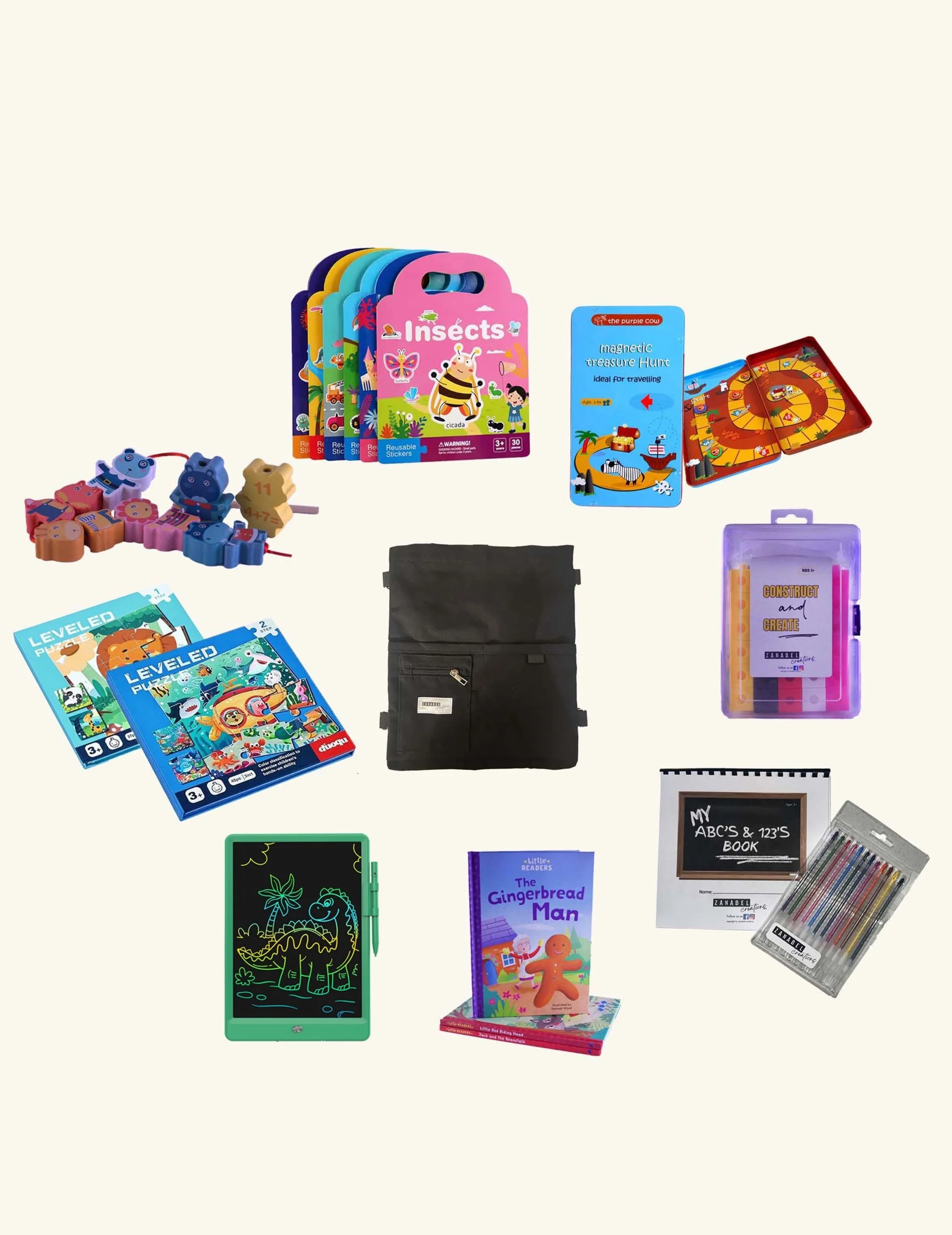 Children's educational toys, books, art supplies, and game items arranged on a white surface.