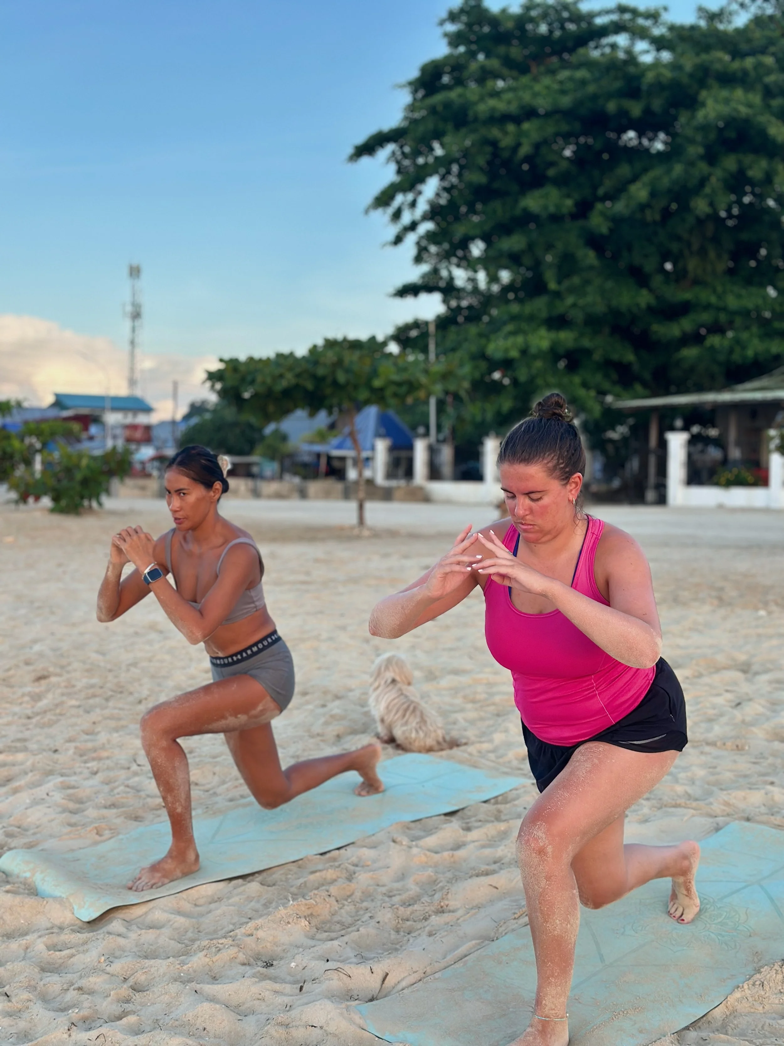 Luna and their guest working out on the beach as part of their Swimfit Siargao retreat