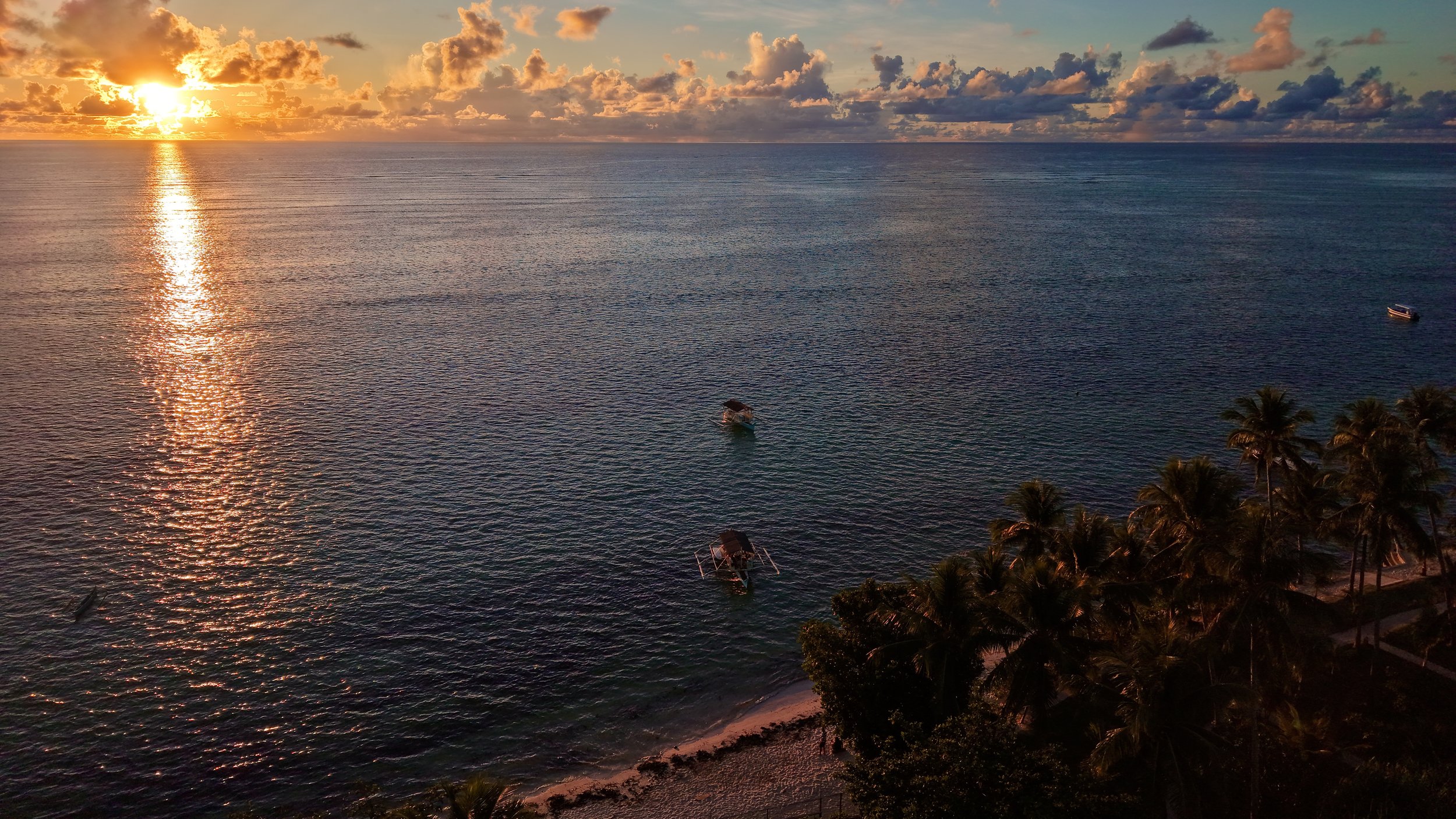 aerial view of the sea and sunset in siargao