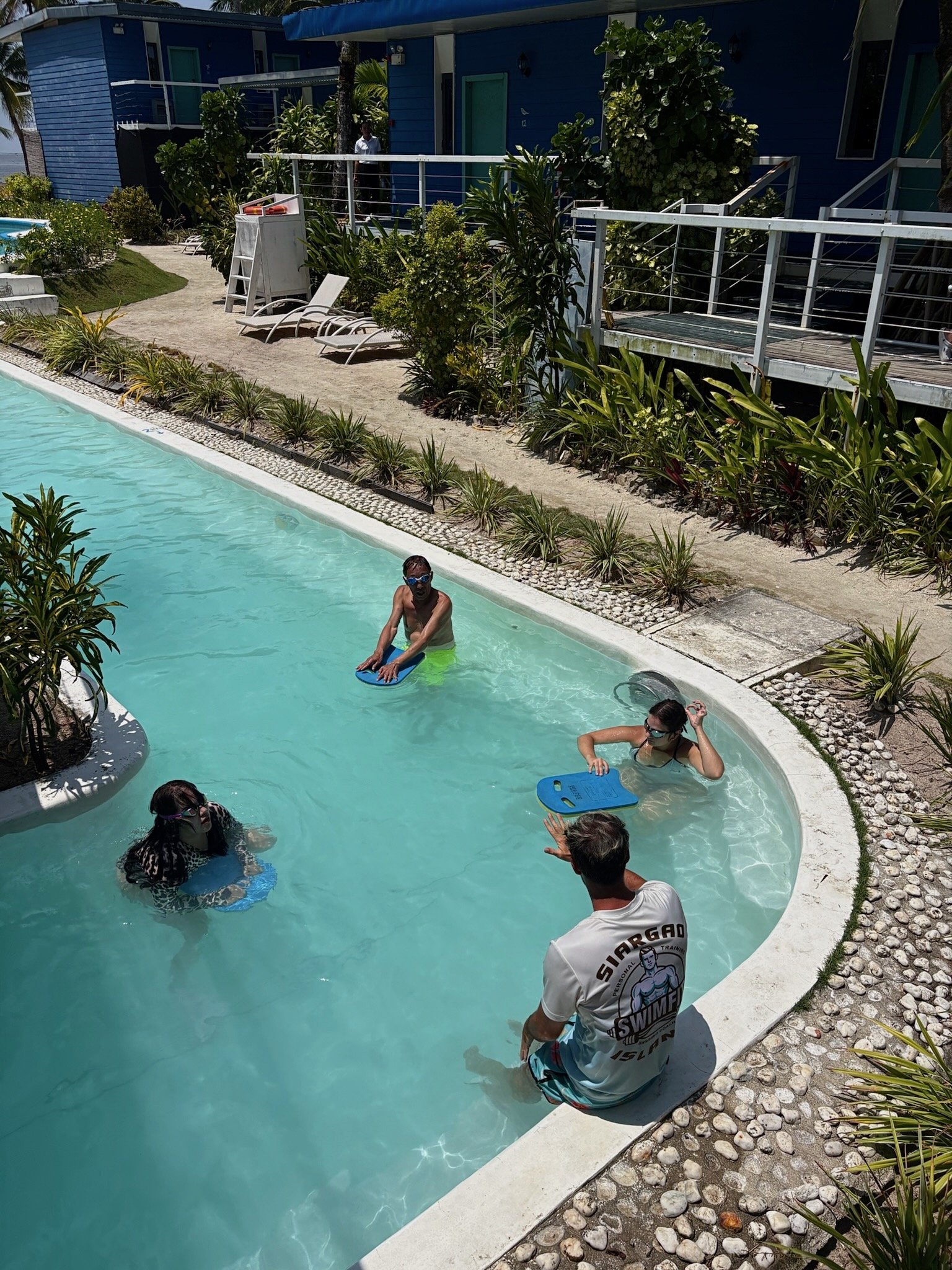 David coaching their guests through swimming exercises as part of their Swimfit Siargao retreat