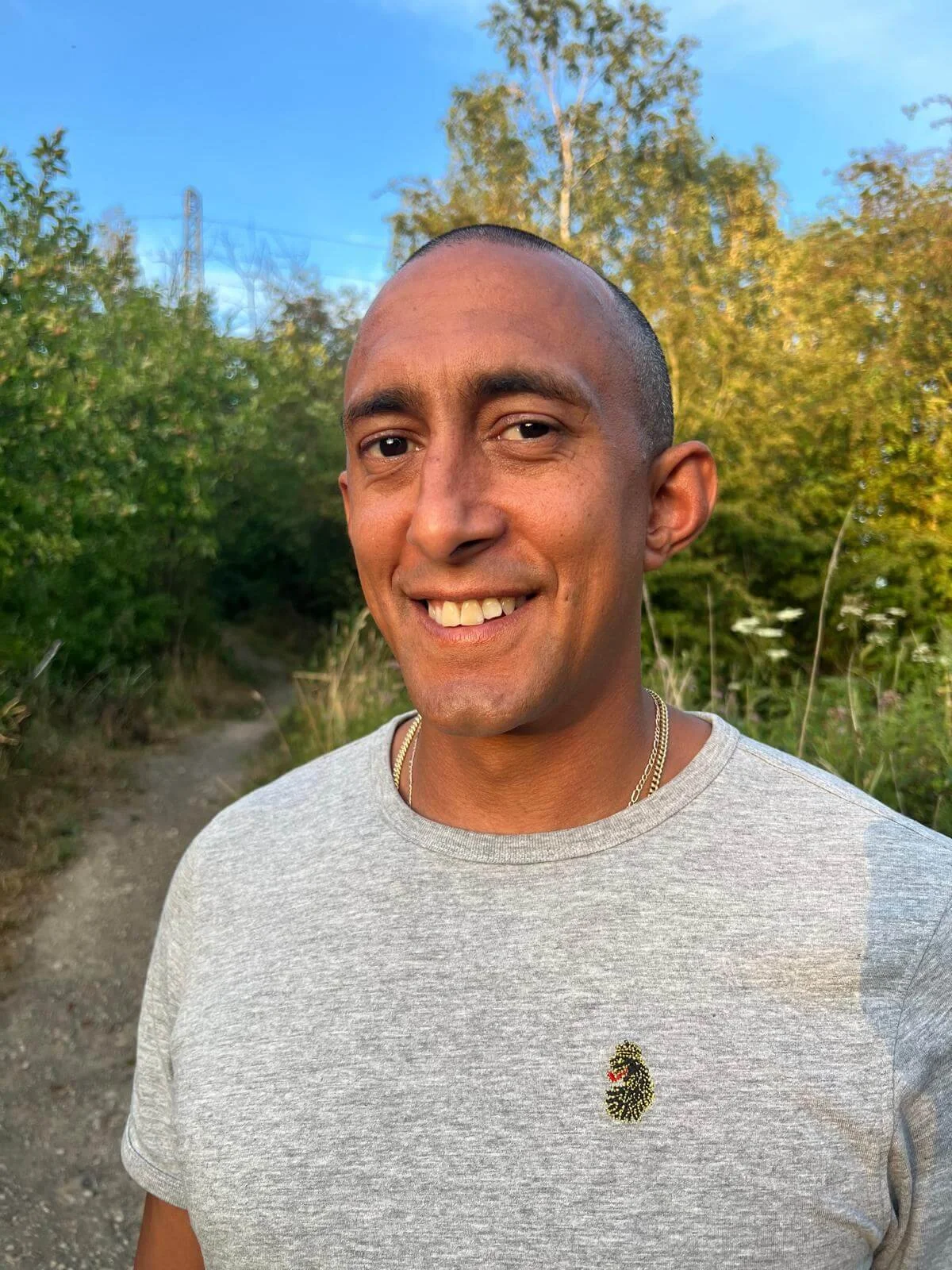 Blake Melisse in nature smiling at the camera