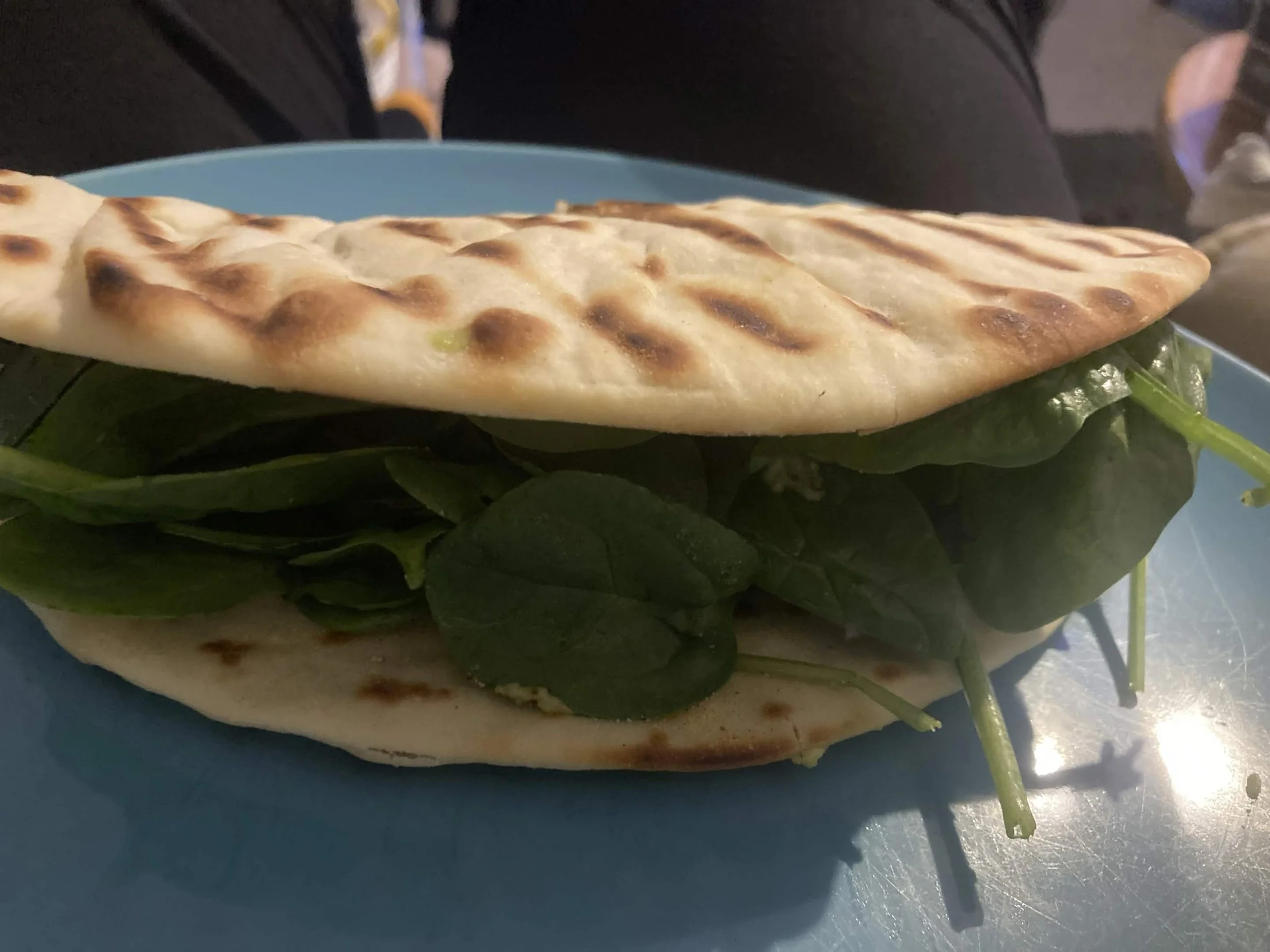 A SOUVLAKI CRUNCH WRAP WITH SPINACH AND ADVOCADO