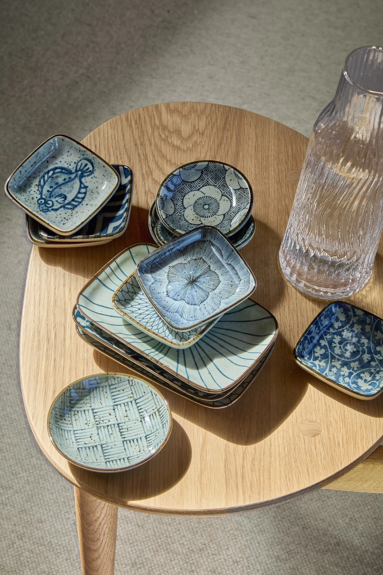 Japanese ceramic plates in blue and white with traditional patterns and artisanal finishes