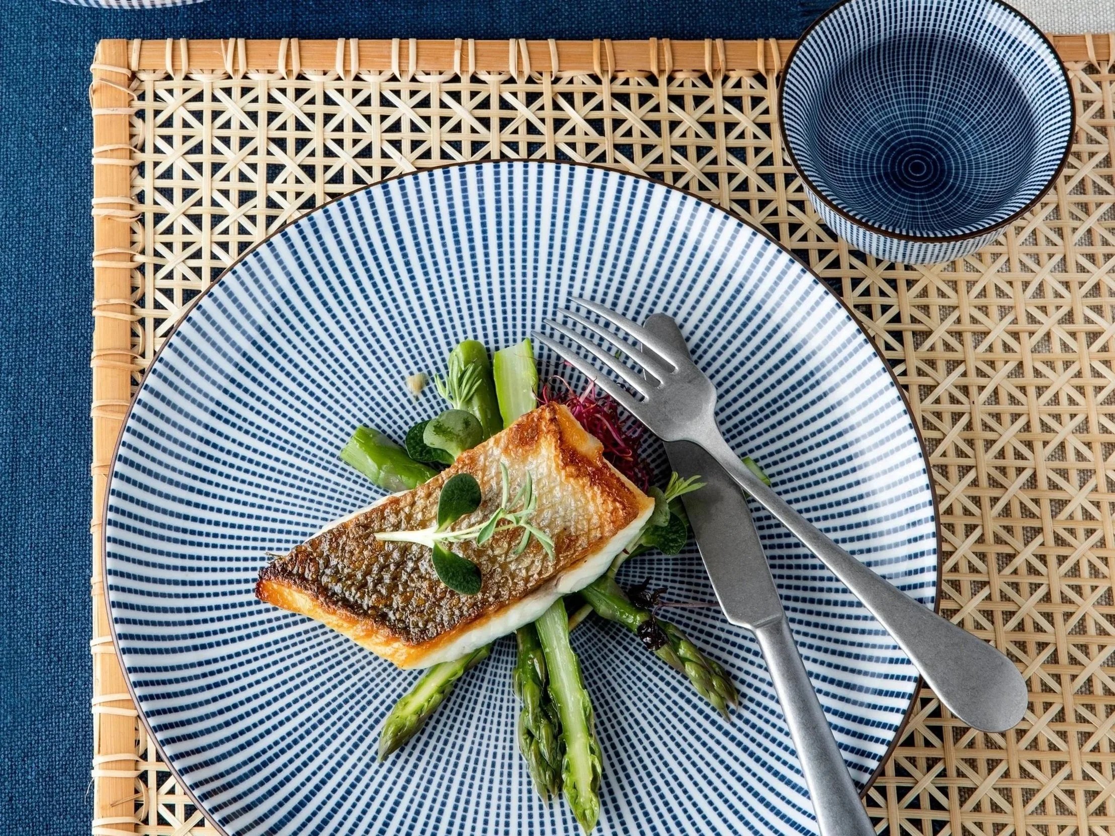 Japanese blue and white ceramic plate with traditional Tokusa striped pattern