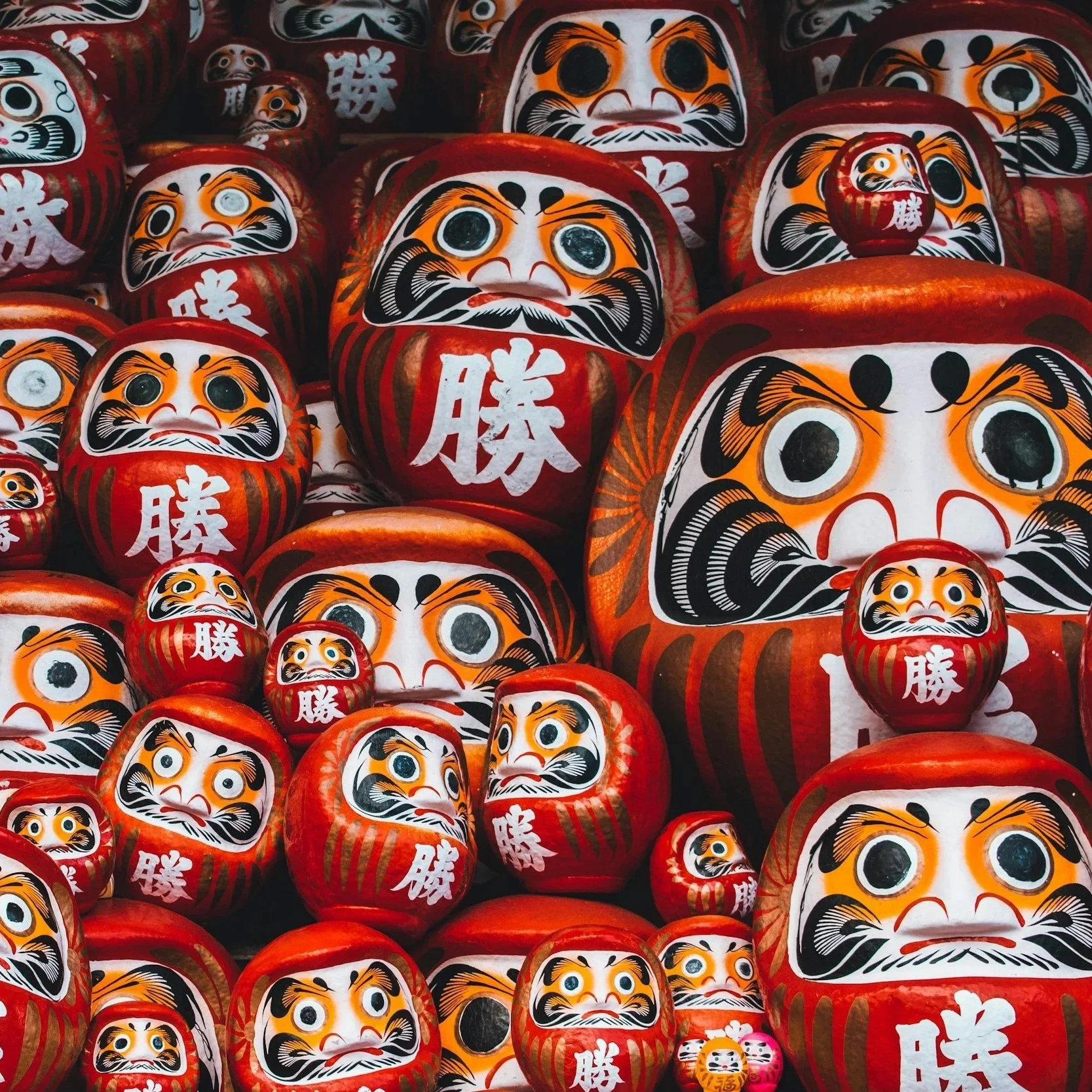 Japanese Daruma dolls collection – red hand-painted good luck figures with victory kanji