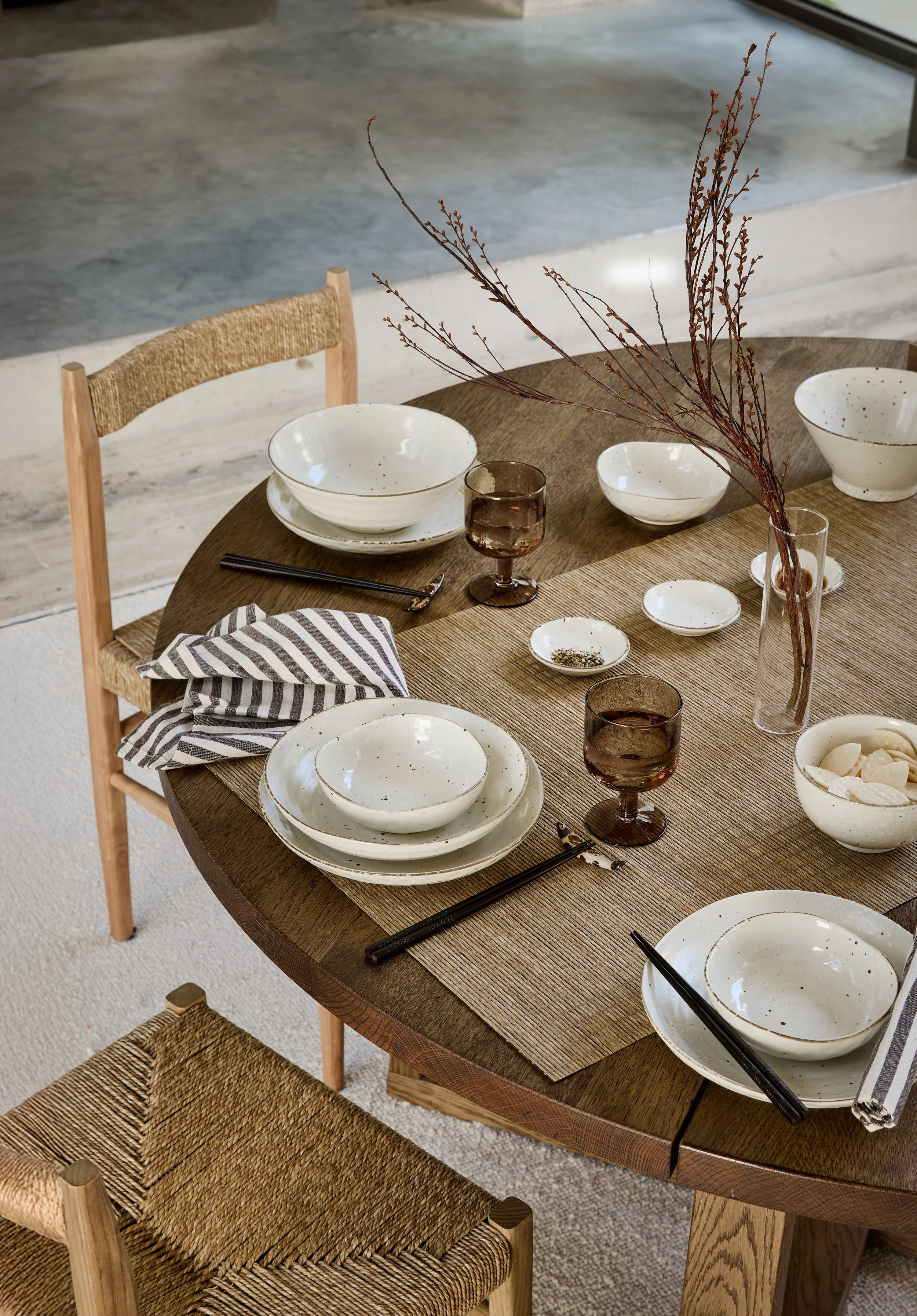 Japanese ceramic dinnerware in neutral tones styled on a natural dining table