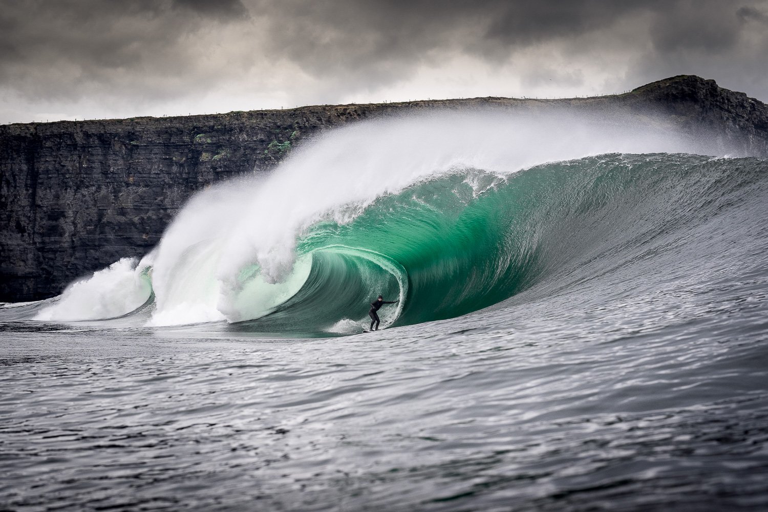 heavy-barrel-wave-cliff-backdrop-surfing.jpg