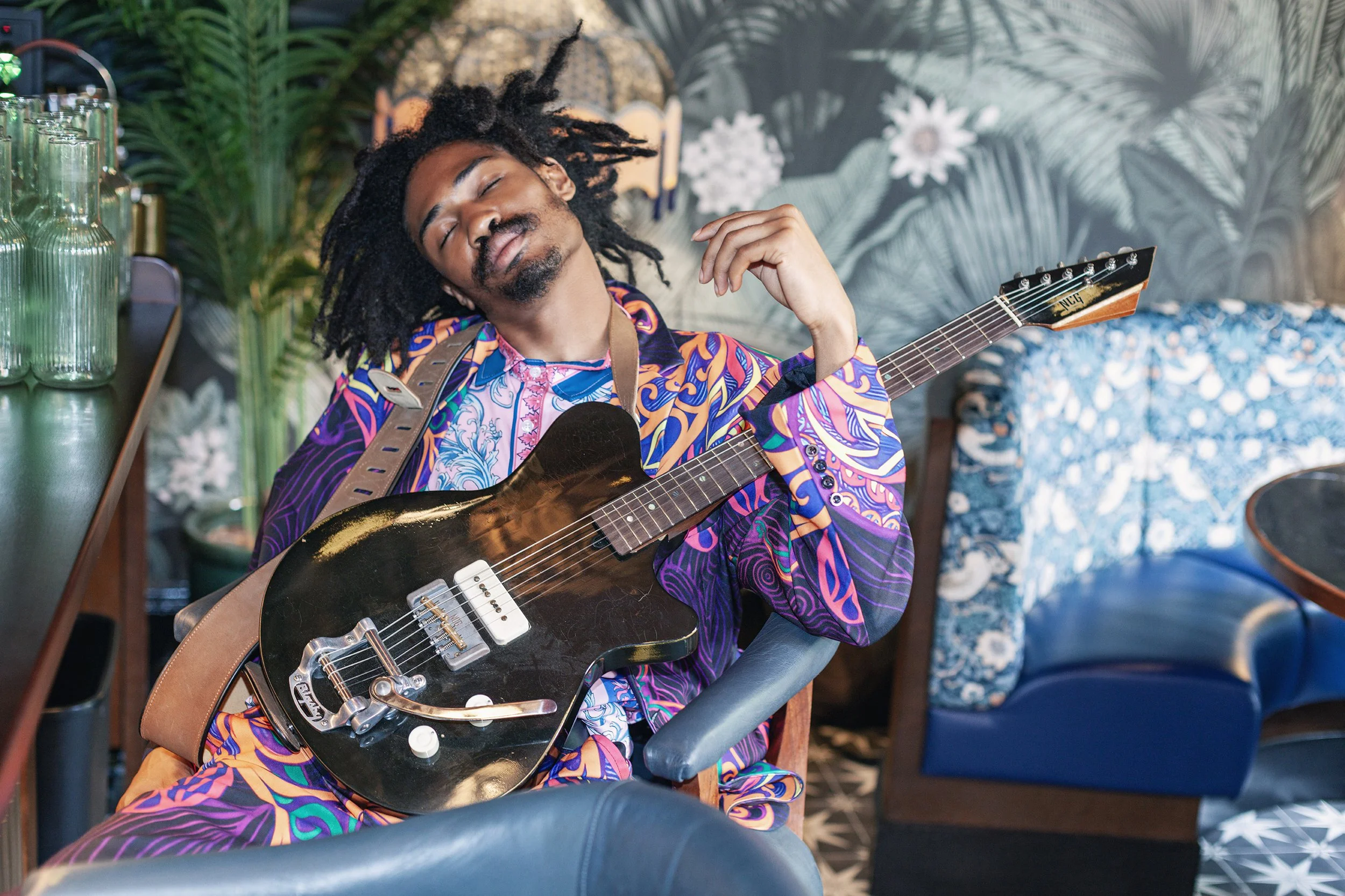 IMG_Luisa Young - relaxed man with guitar head back.jpg