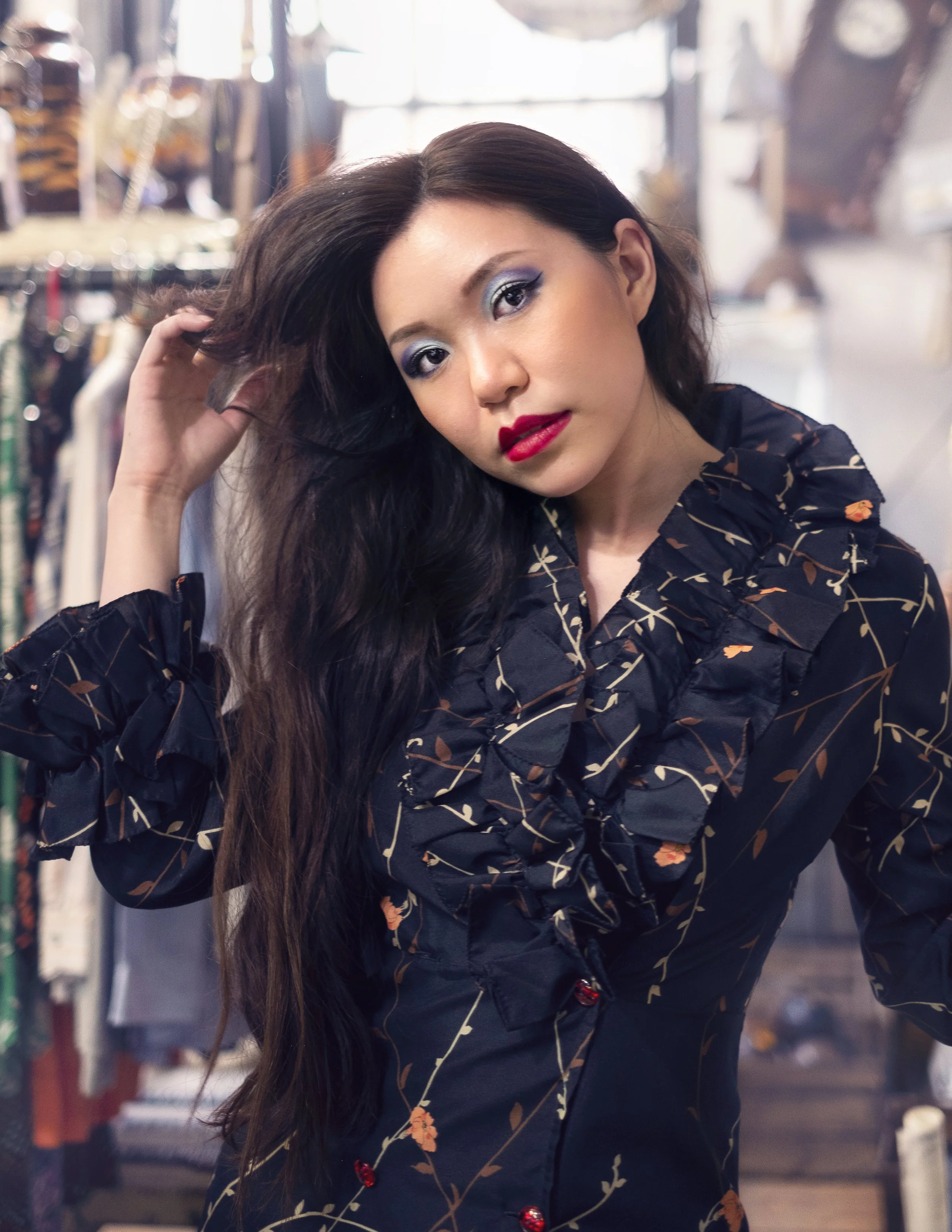Editorial Shoot by Luisa Young of an Oriental Girl with long hair in a Vintage shop