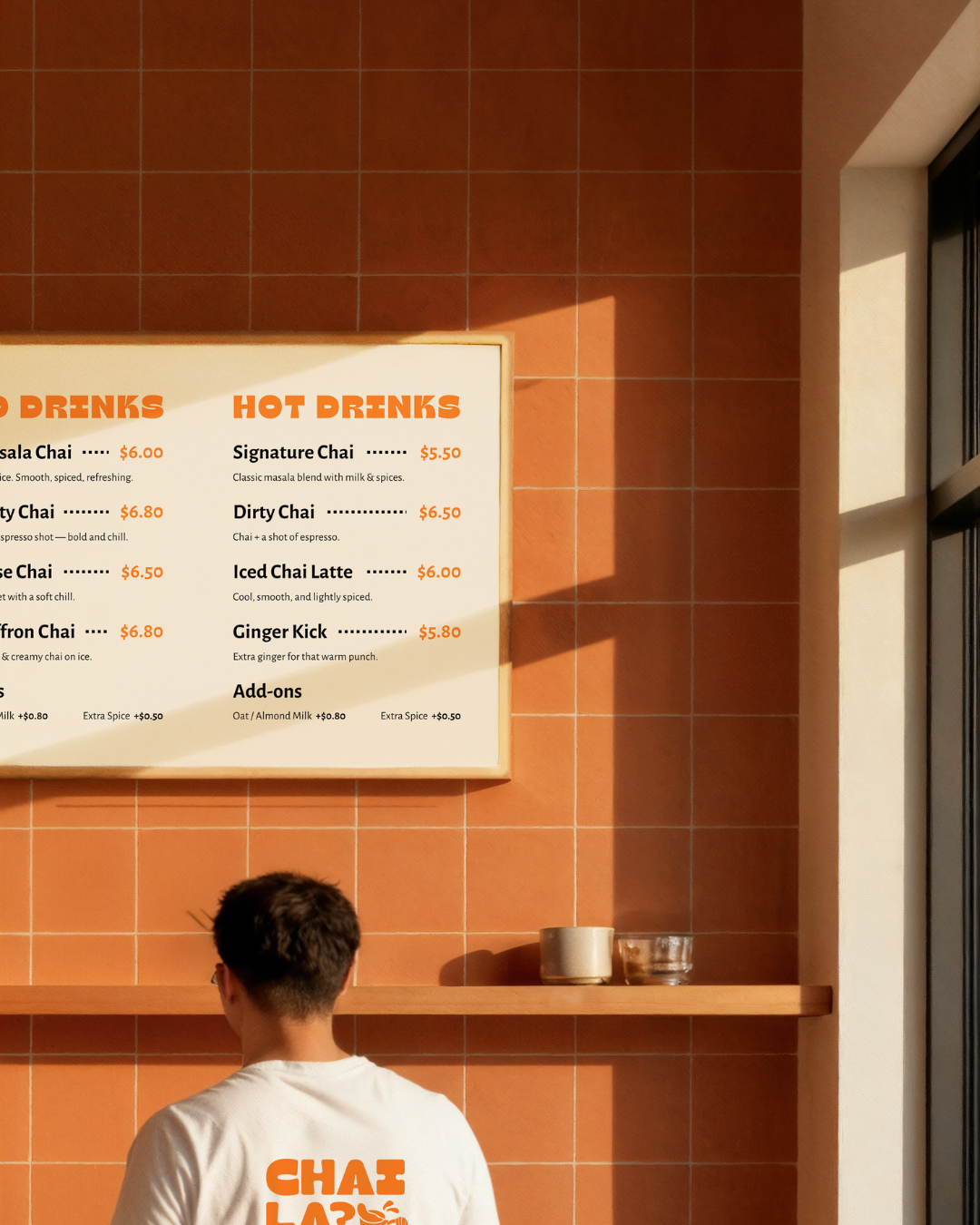 Contemporary cafe interior with CHAI LA menu board