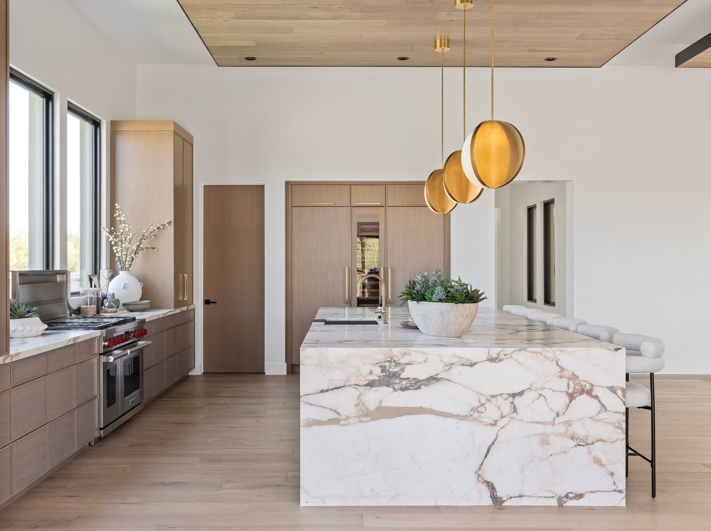 Calacatta Viola takes center stage at Whisper Rock Haven &mdash; bringing bold, expressive movement to the great room fireplace, primary bath, and casita kitchen. With its dramatic veining and rich burgundy tones, this striking stone adds depth, cont