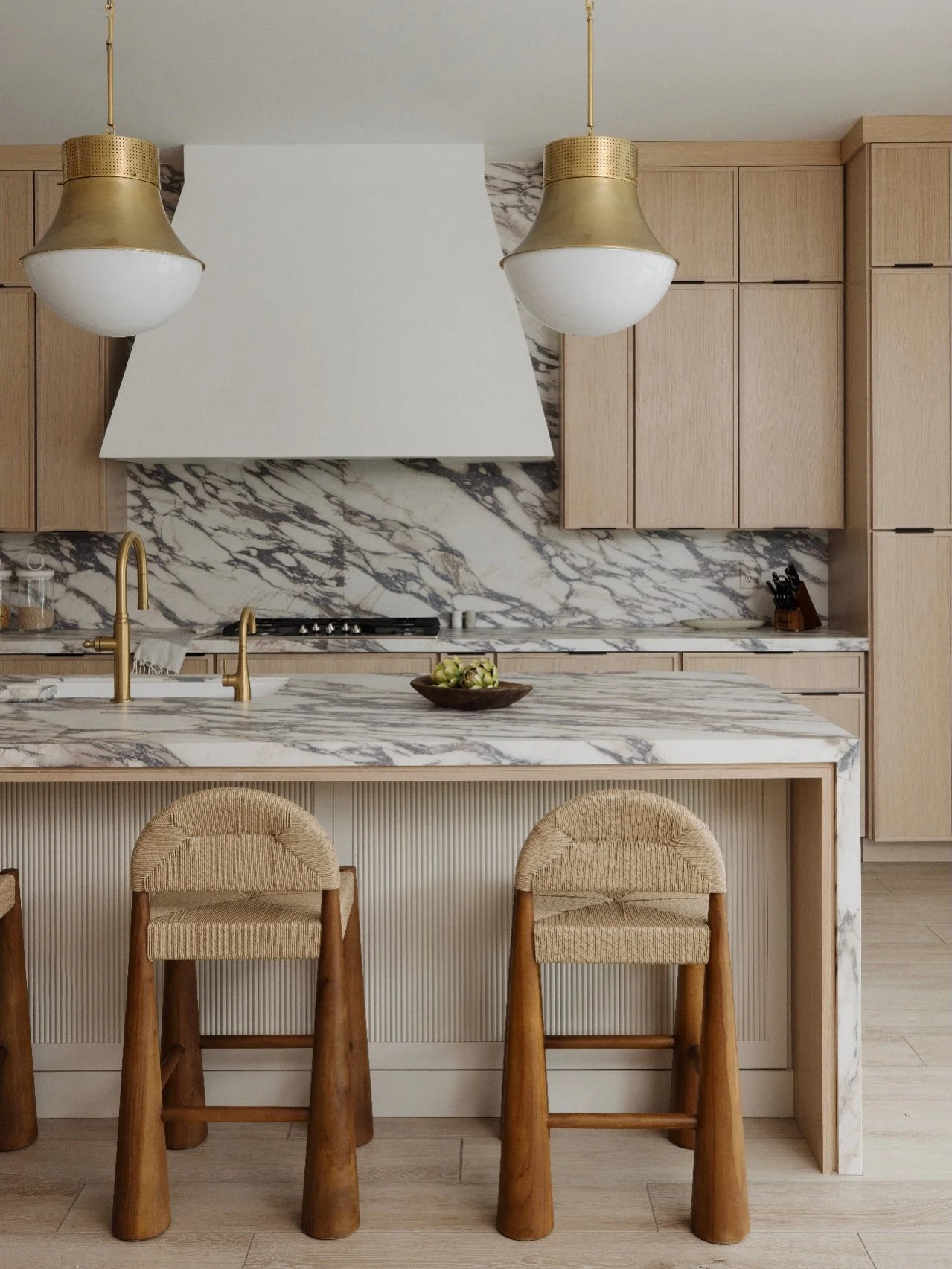 Bold and grounded for our kitchen and dining area in #MaisonViolaByGHD. The statement stone sets the tone, wrapping the island and backsplash in strong, graphic veining. Reeded detailing beneath the island adds texture and dimension, balancing the mo