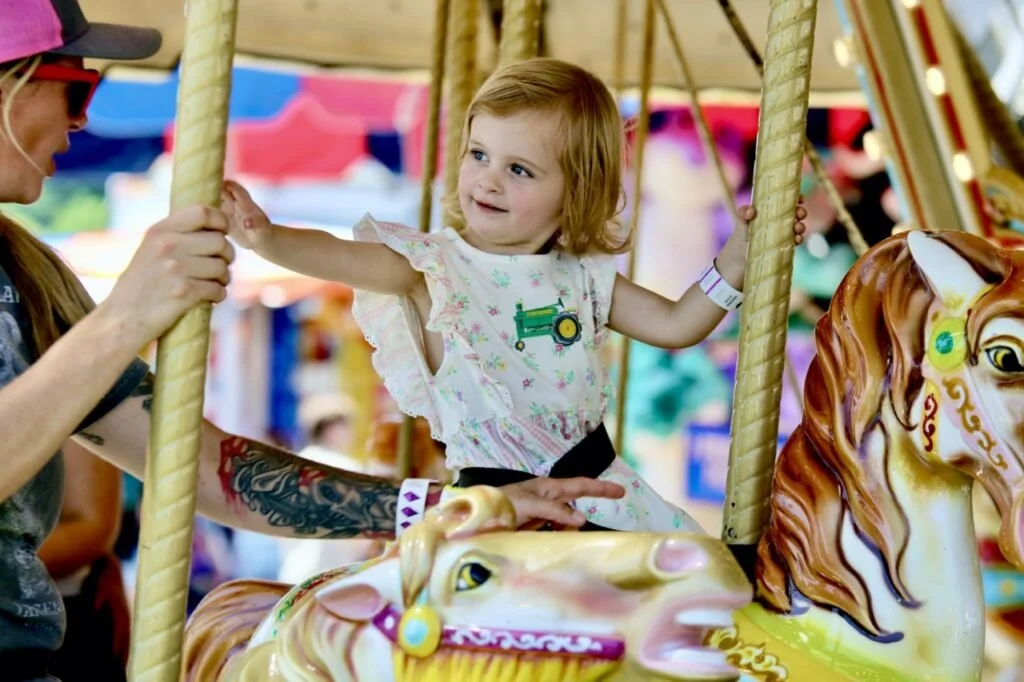 Sandra-Griswold-2-of-Hinesburg-rises-the-carousel-with-her-mom_-Large-1024x682.jpeg