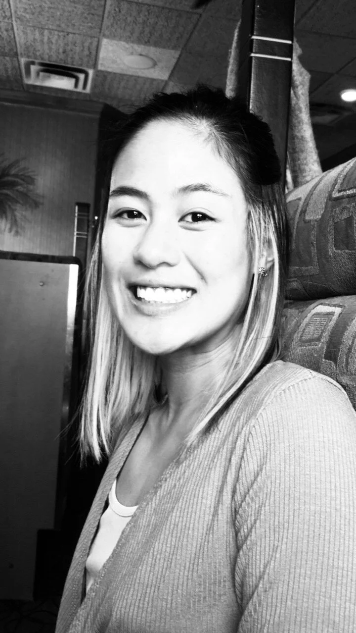 Smiling person in a restaurant booth Nate