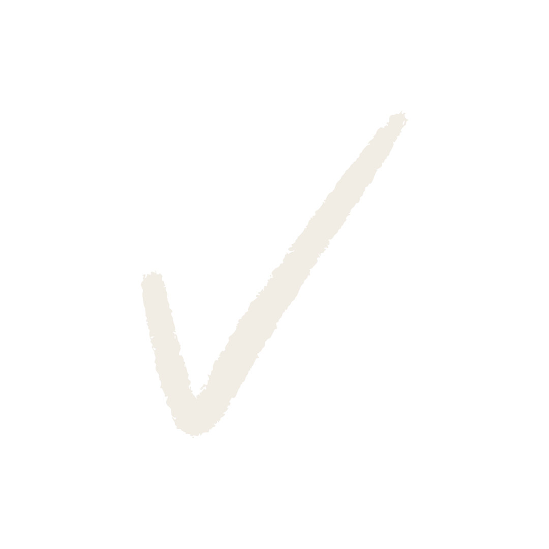 Een witte vink op een zwarte achtergrond.