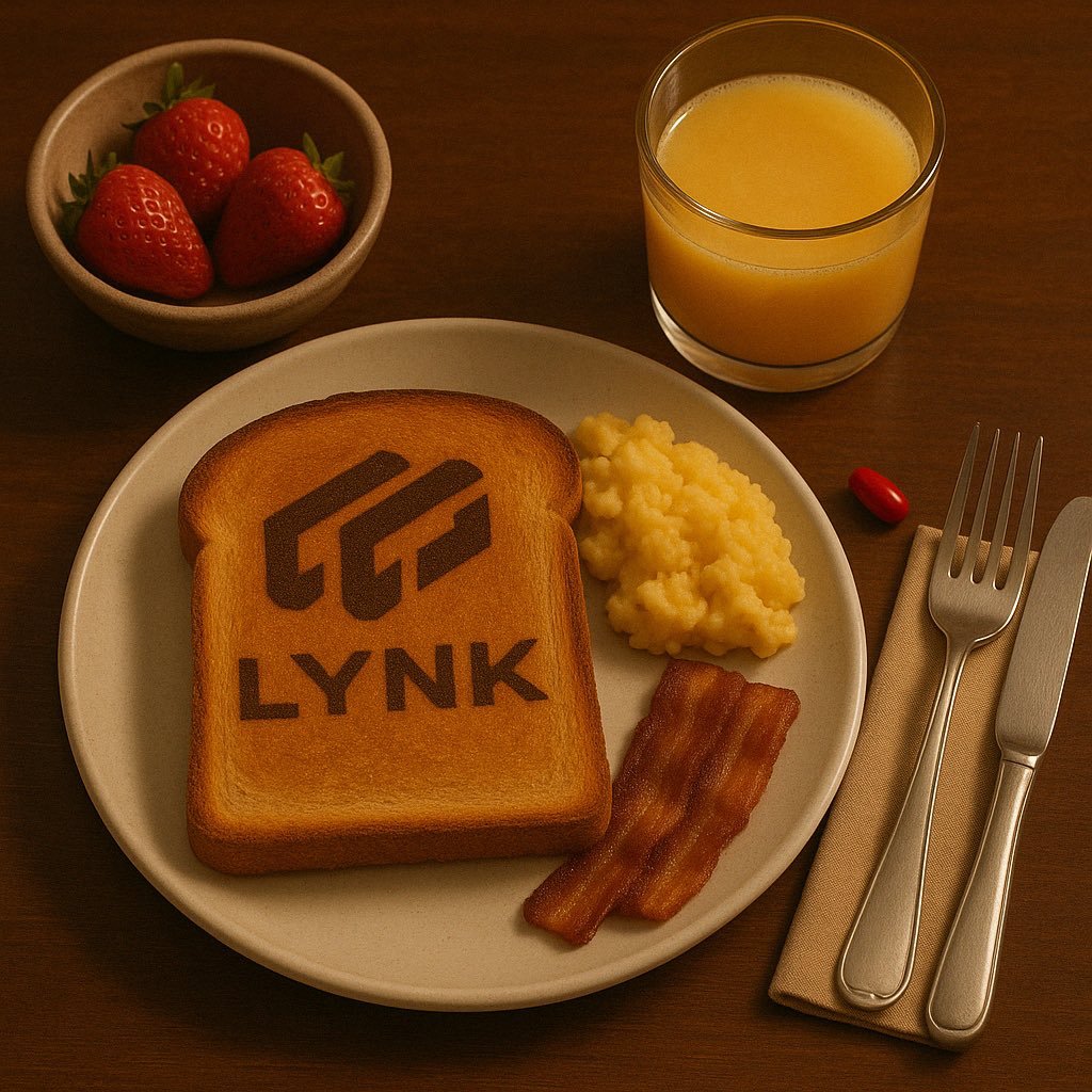 Breakfast plate featuring toast with "LYNK" logo, scrambled eggs, bacon, a glass of orange juice, strawberries in a bowl, and a red pill next to cutlery on a napkin.