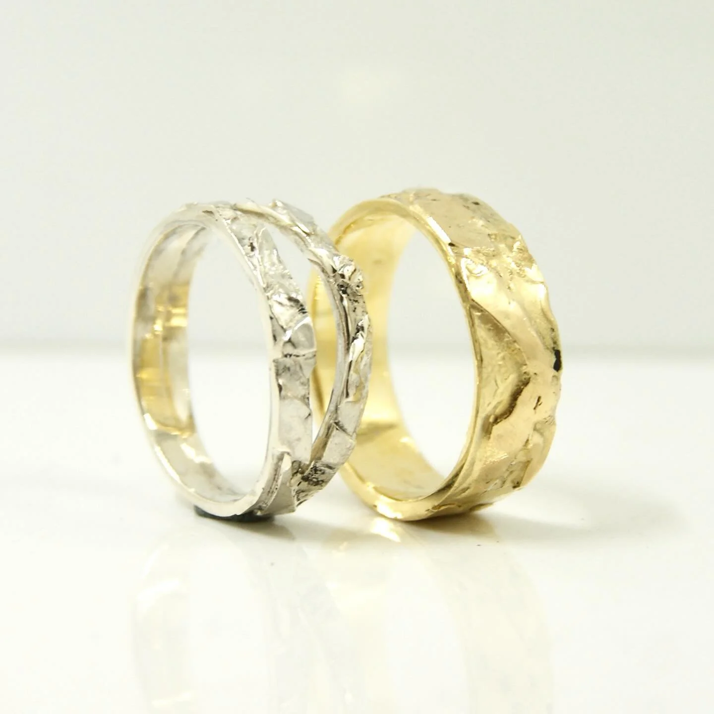 Layered and molten silver and gold make these beautiful one of a kind wedding rings. #goldsmith #galeriepuur  #gold #layered #ringsofinstagram  #ring #rotterdam #weddingrings #moltengold #oneofakindjewelry #goudsmid #weddingring #jewelrydesign #zwaan