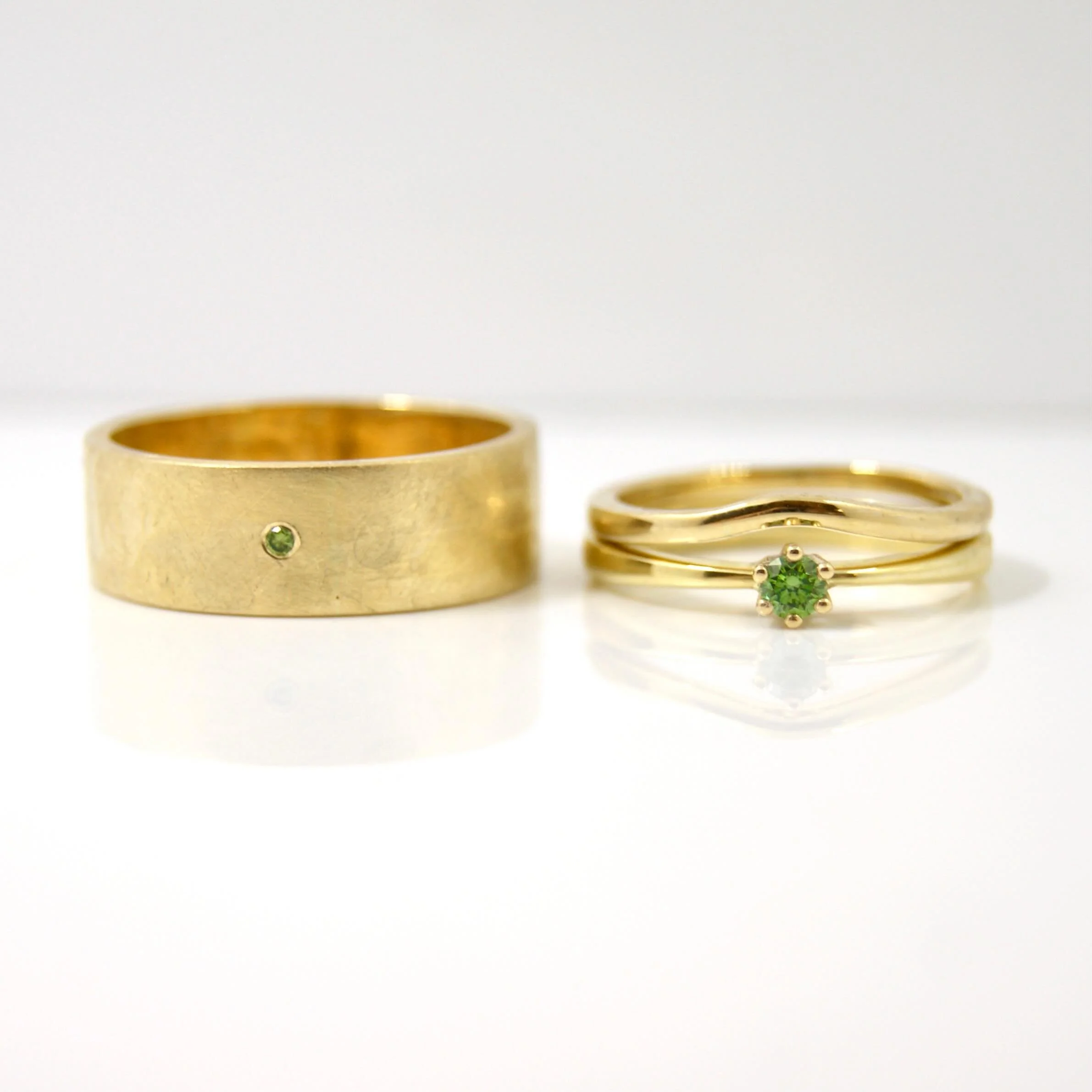 Gorgeous Green! A last minute addition to this beautiful wedding set in the form of a green diamond made this set complete. #greendiamond #galeriepuur #goldsmith #weddingrings