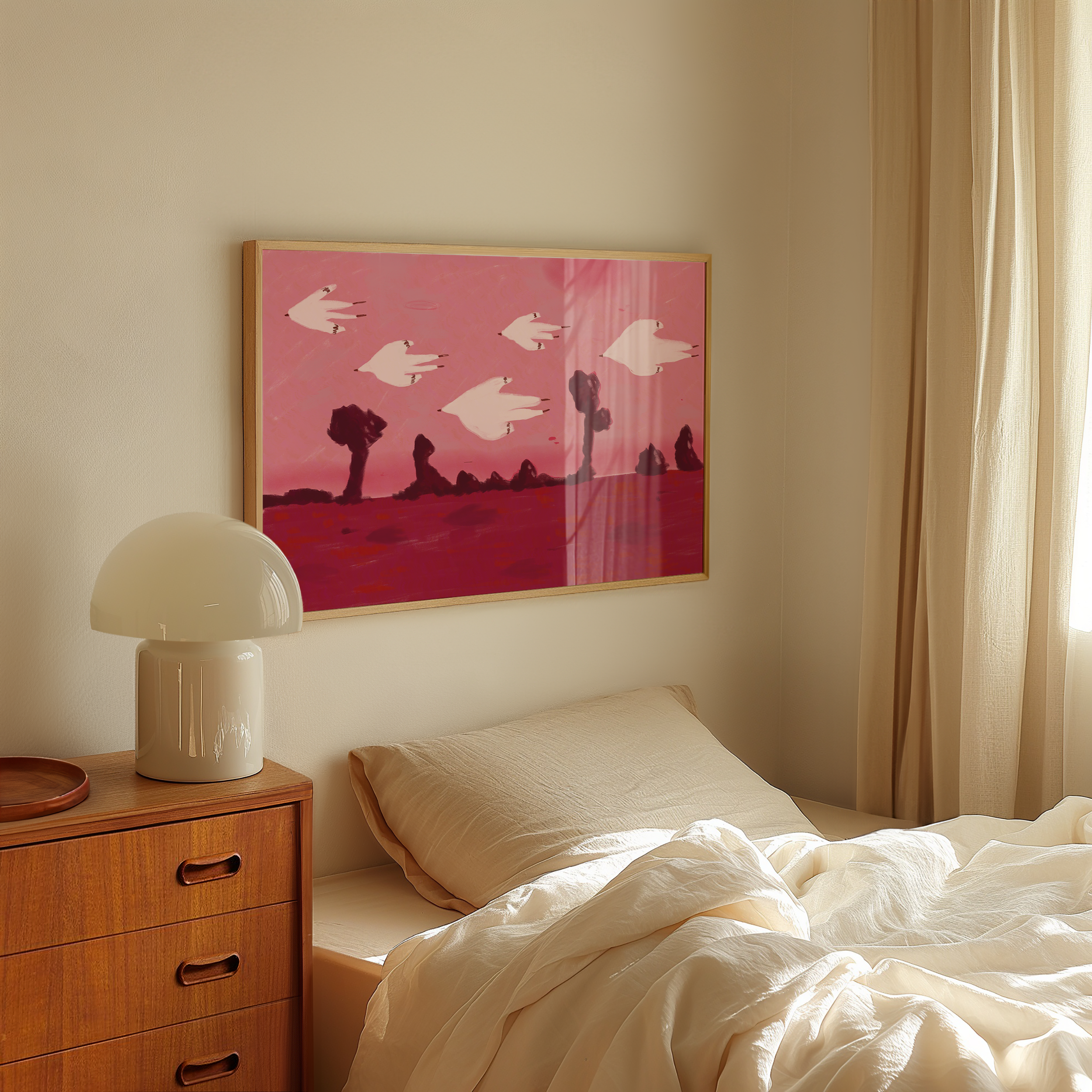 A bedroom corner with a wooden nightstand, a white modern lamp, a beige pillow, and a cream bed with disheveled bedding. There is a pink framed painting of flying white birds in a landscape with trees on the wall. Sunlight streams in through curtains on the right.