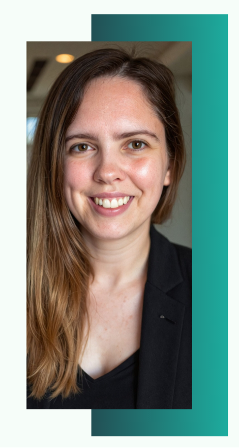 Close-up of a Founder Tiffany Dougherty with long brown hair, smiling, wearing a black blazer, in an indoor setting.