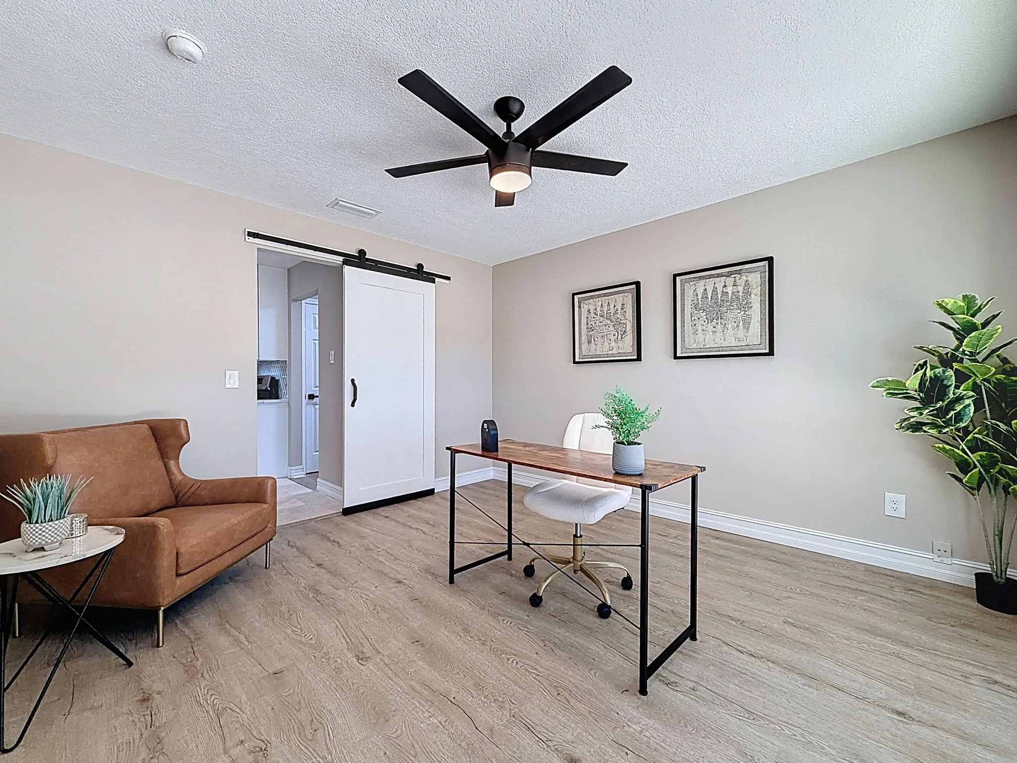 Front formal dining room staged as an office.