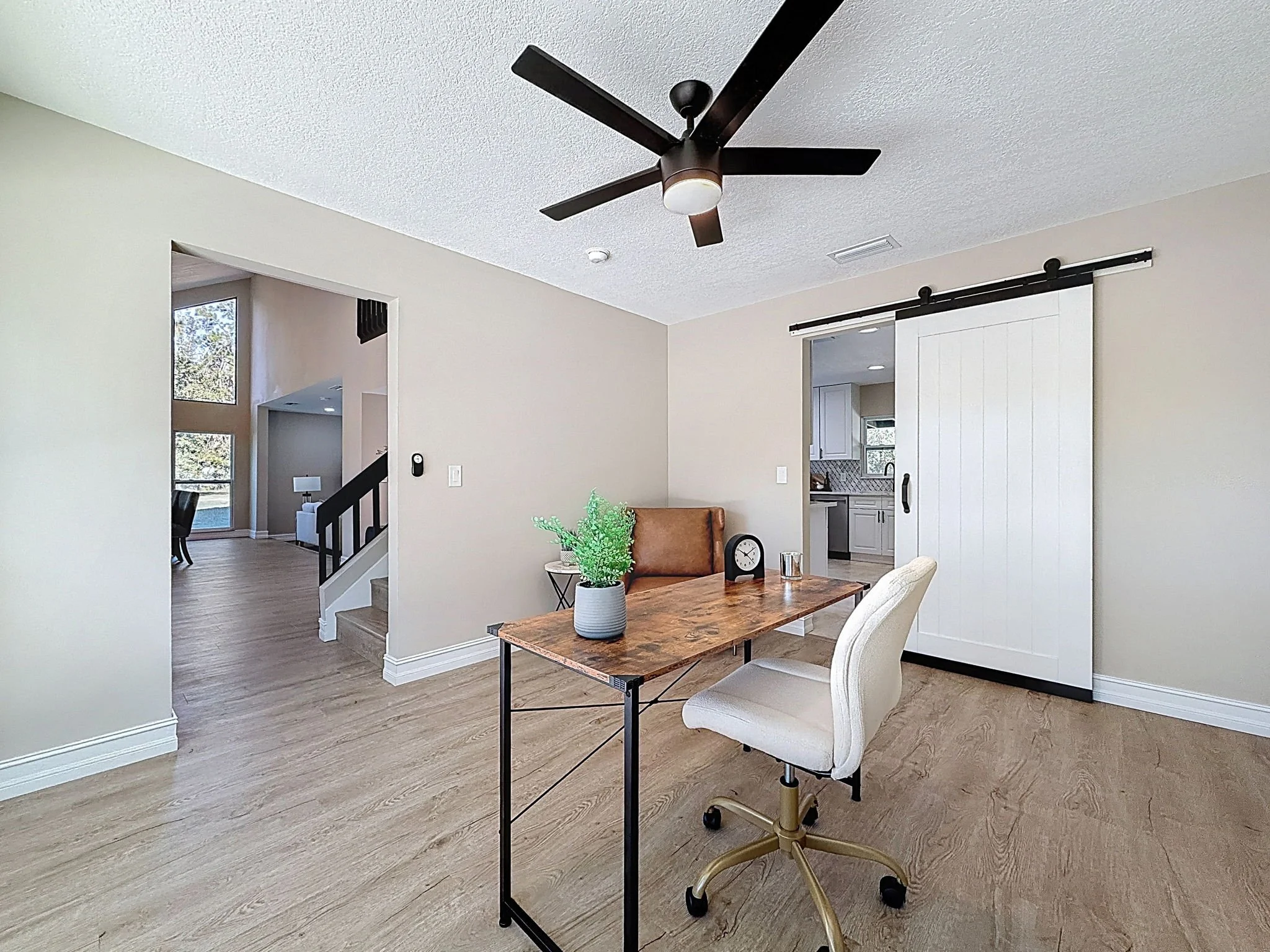 Front formal dining room staged as an office.