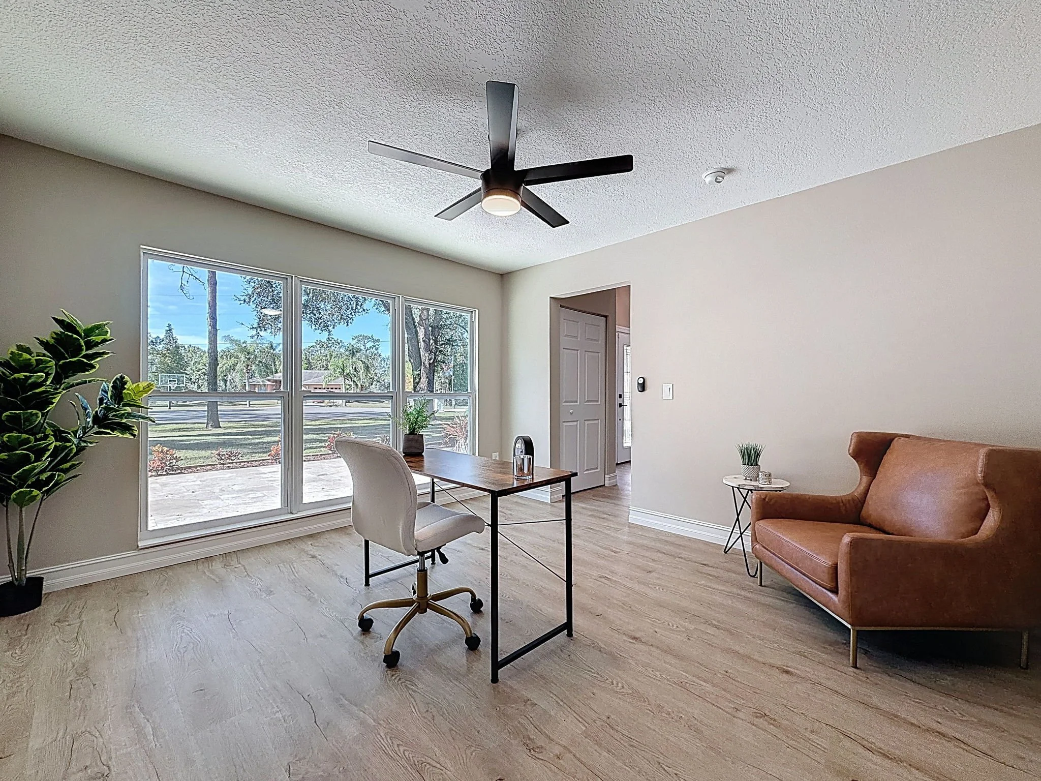 Front formal dining room staged as an office.
