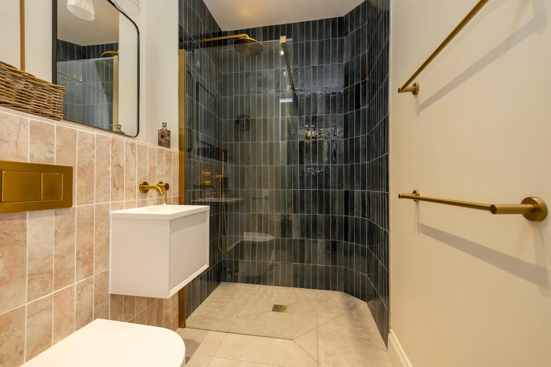 new shower room with green tiles and pink tiles 
