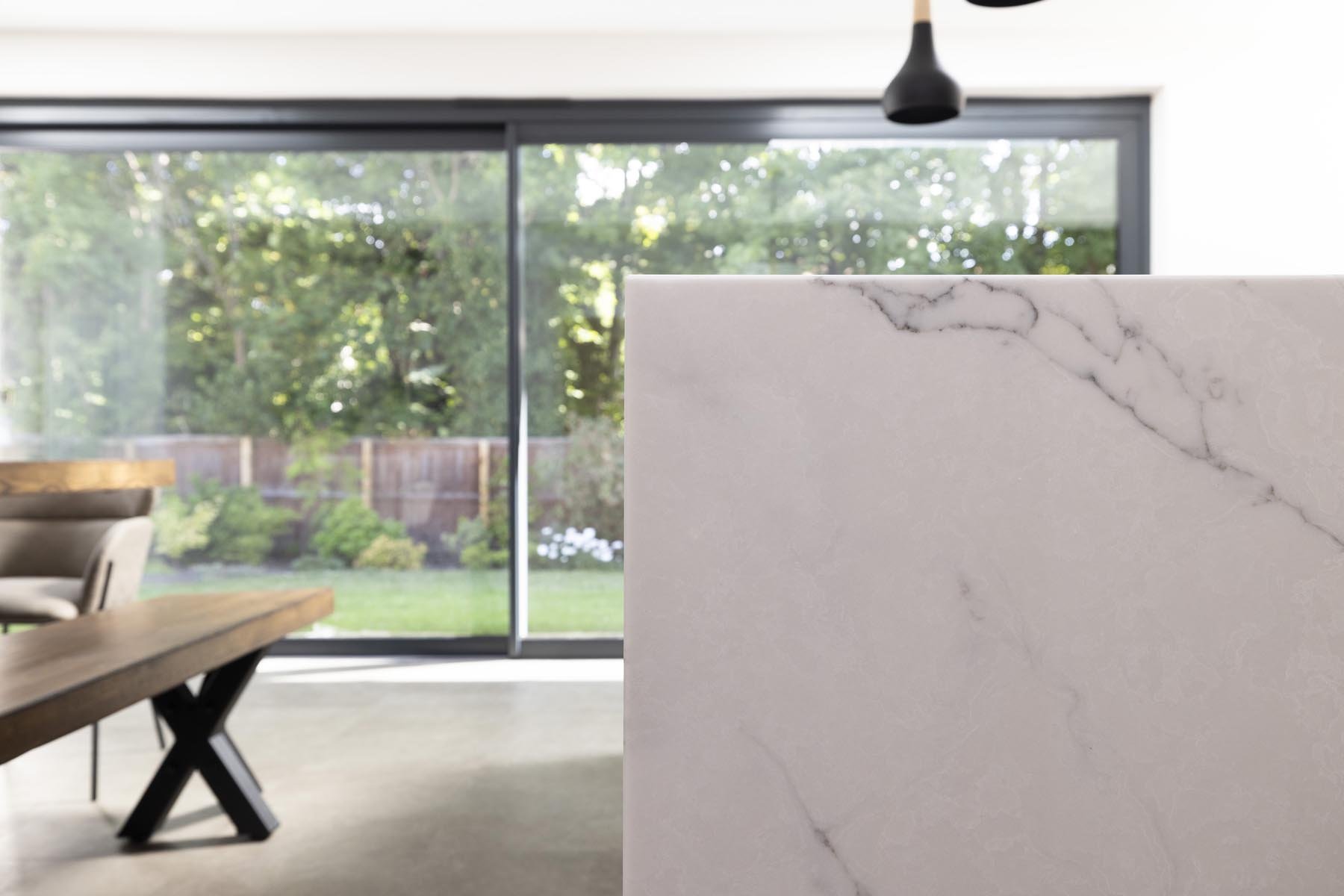 view of kitchen island and aluminium sliding doors