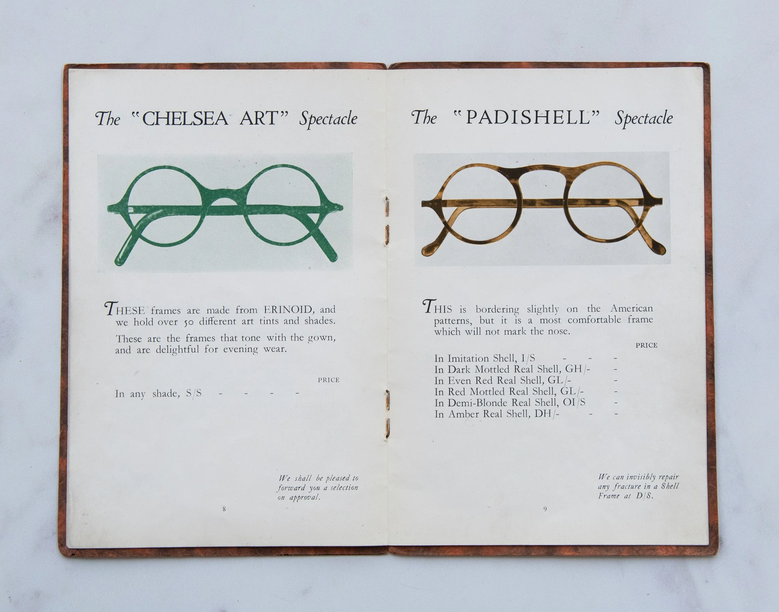 Open booklet showing illustrations and descriptions of two styles of eyeglass frames, labeled 'Chelsea Art' on the left and 'Padishell' on the right.