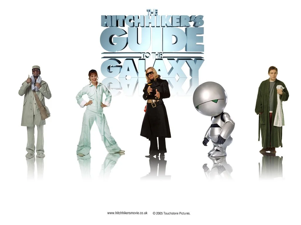 Promotional poster for 'The Hitchhiker's Guide to the Galaxy' featuring five characters: a man in a trench coat and glasses, a woman in a lab coat, a woman in a black coat with sunglasses, a small robot, and a man in a robe holding a drink, with the 