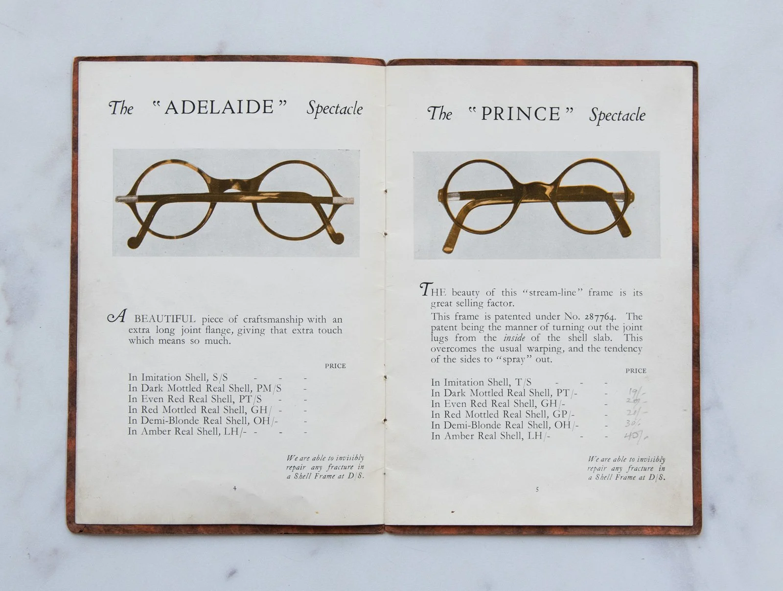 Open vintage book showing two pages with antique eyeglass frames, one labeled 'Adelaide' and the other 'Prince,' accompanied by descriptions and pricing.
