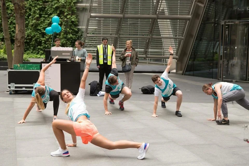  Competitors looking at the 35 floors of the Conquer the Tower during their warm up with Grace for Trekstock. 