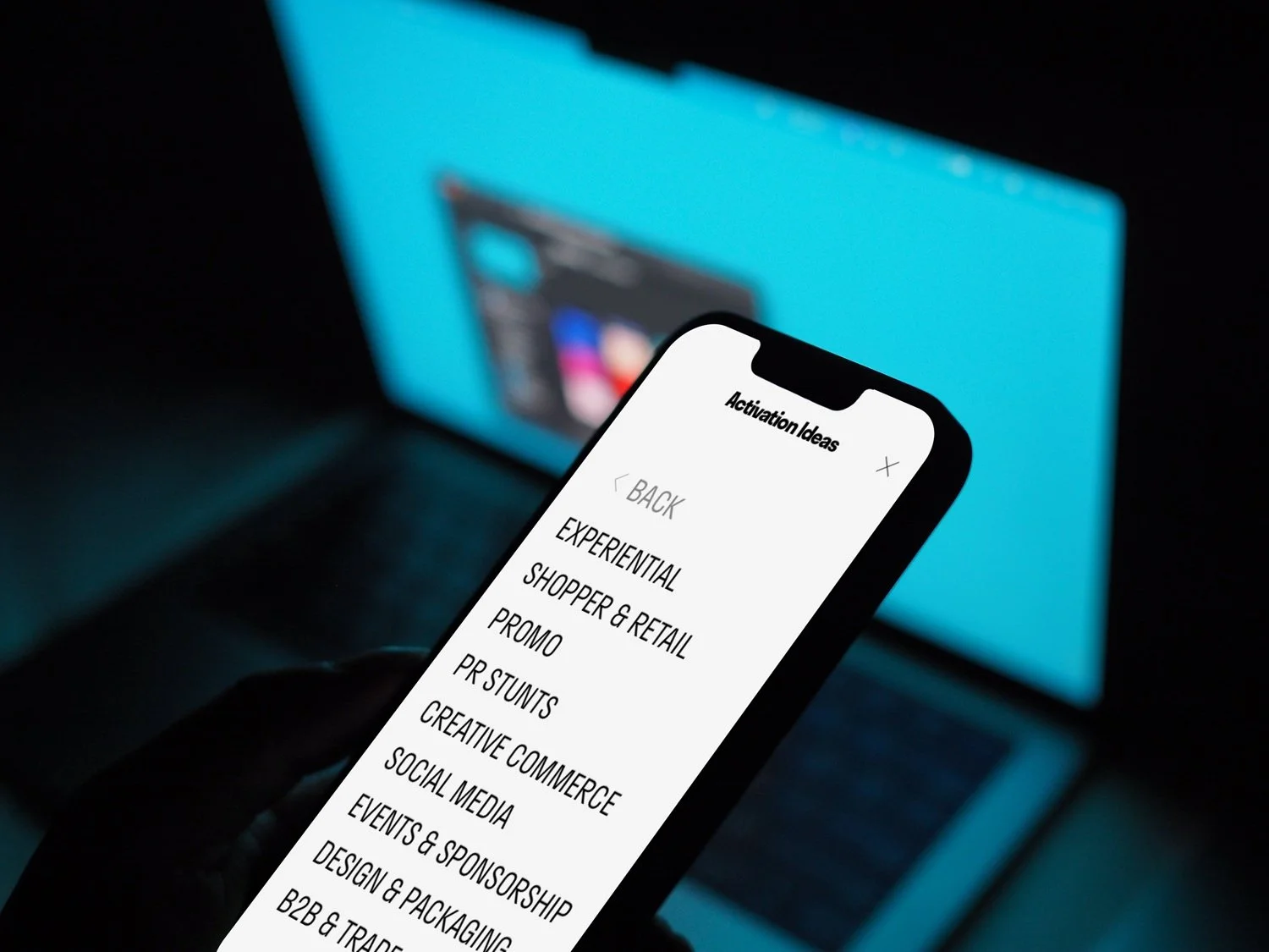 mockuuups-hand-holding-an-iphone-13-mockup-2.jpg