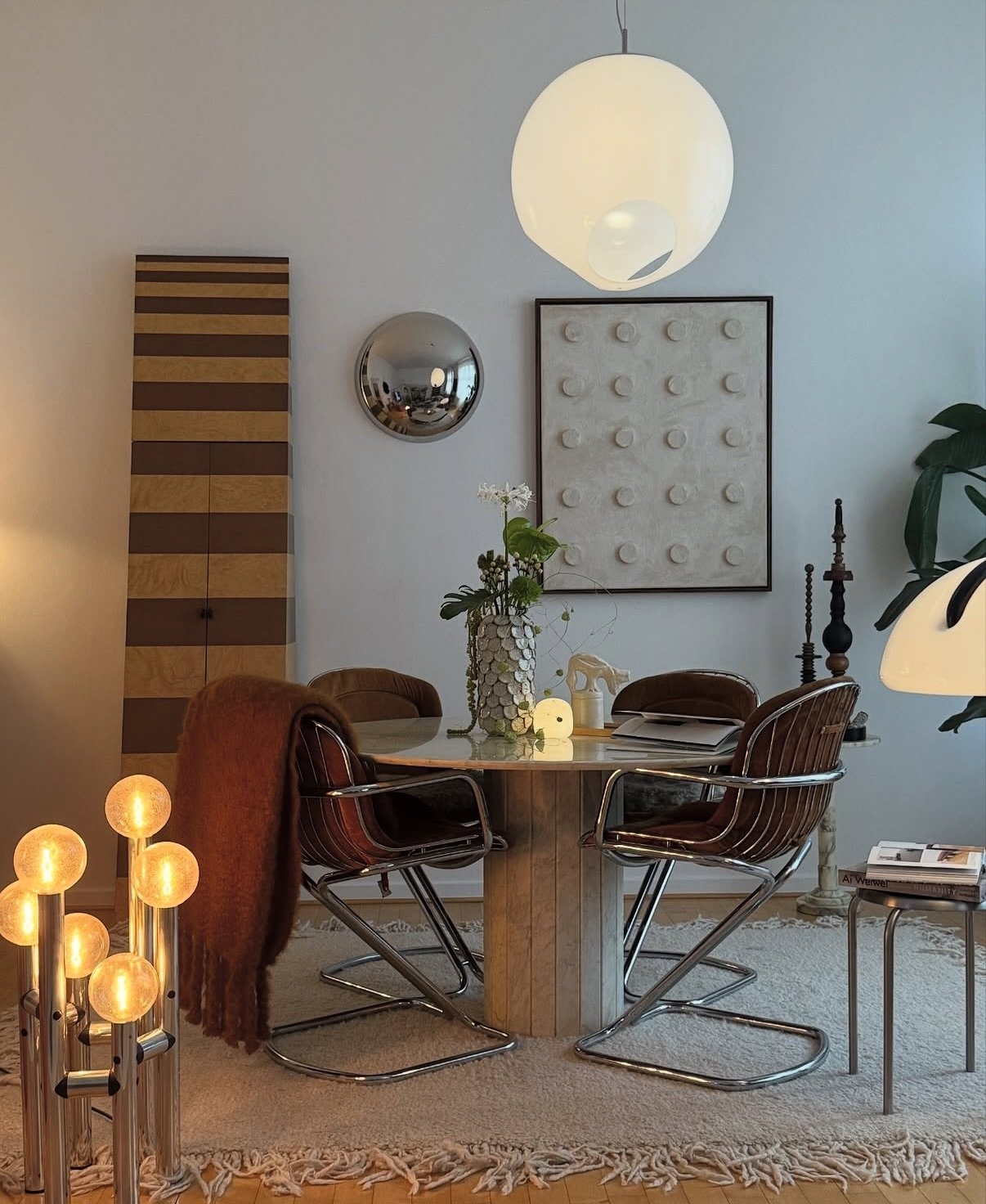 A symphony of sculptural form and soulful materials this curated living-dining space by @diamerisma blurs the line between vintage modernism and contemporary poetry. Warm tobacco tones, marble textures, and tactile upholstery create an intimate sanct