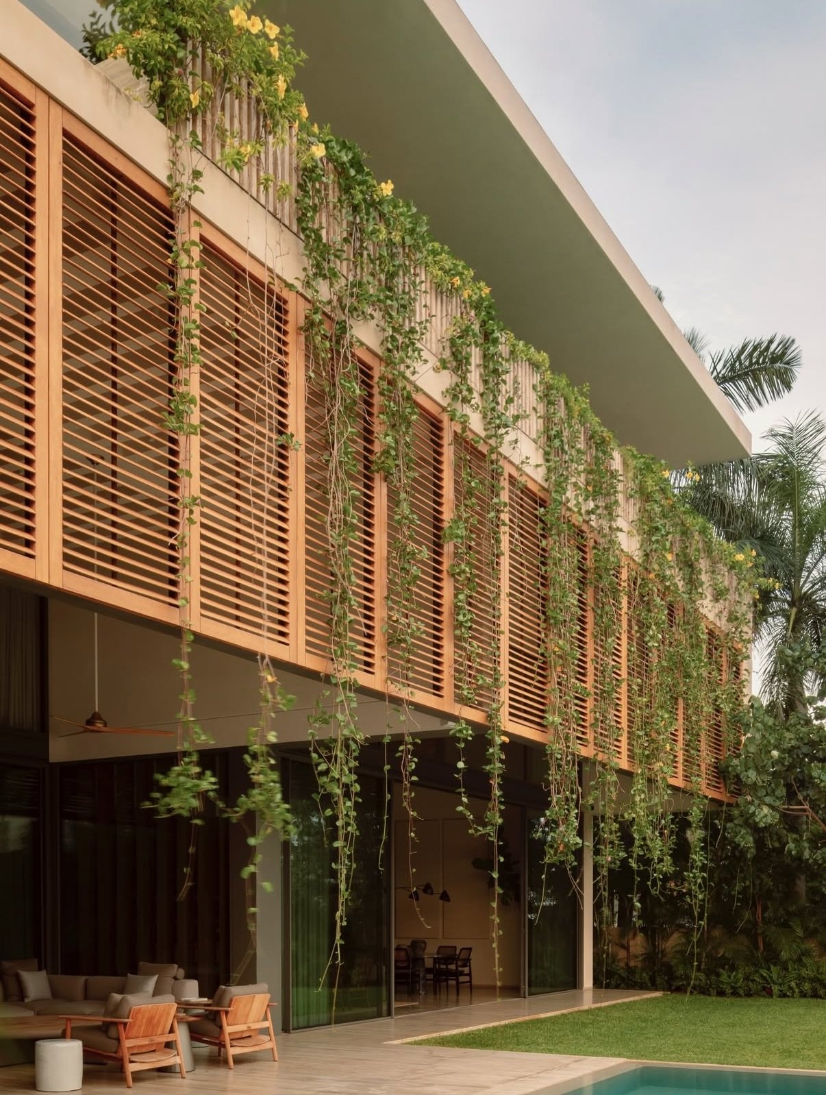A modern tropical home in Canc&uacute;n where architecture responds intuitively to climate, light, and landscape. Layered volumes, open courtyards, and shaded transitions invite air and greenery to move freely through the space, dissolving the bounda