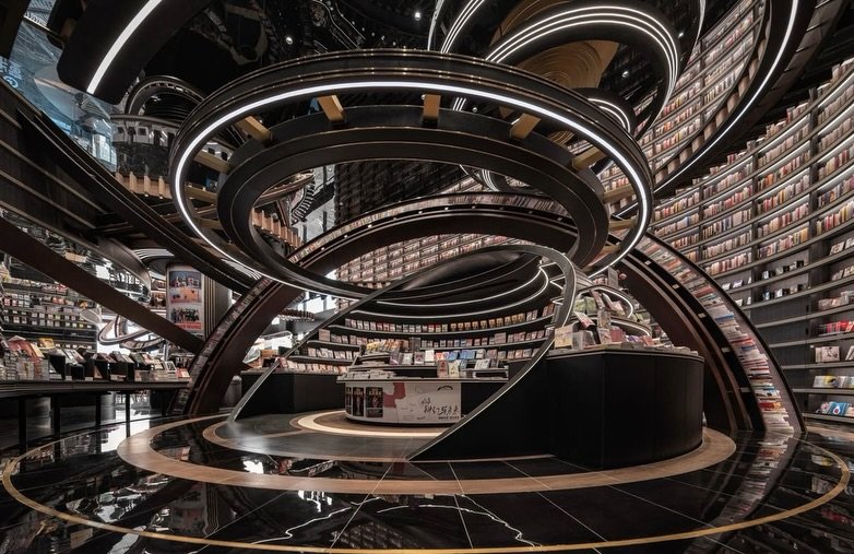 A bookstore reimagined as a celestial instrument, where architecture becomes orbit, and books become constellations.

Layered rings sweep through the space like planetary paths, wrapping shelves into fluid, continuous motion. There&rsquo;s no rigid b