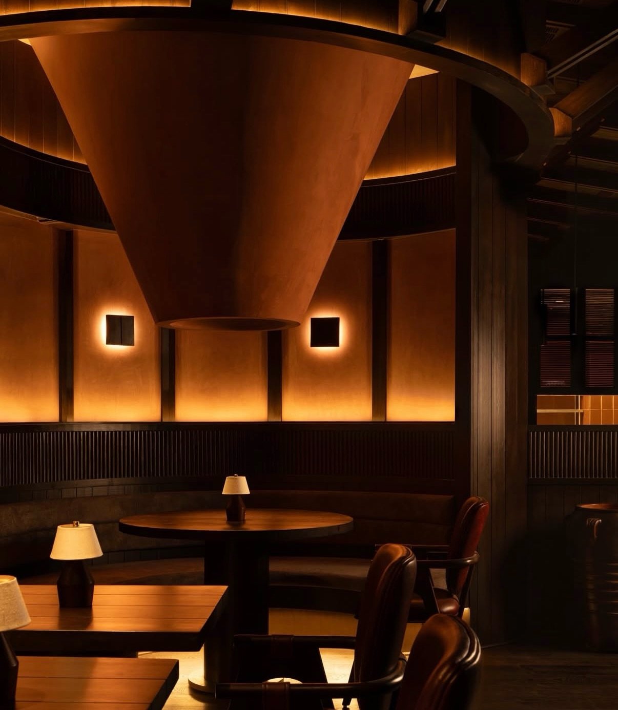 An immersive play of shadow, warmth, and sculptural form&hellip;this space by @renesa.architects for @sheshere_gurgaon redefines what intimate dining feels like. Wrapped in deep amber tones, textured walls, and curved architectural gestures, the desi