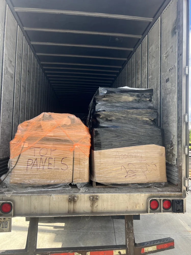 Commercial moving crew with trailer and pallets