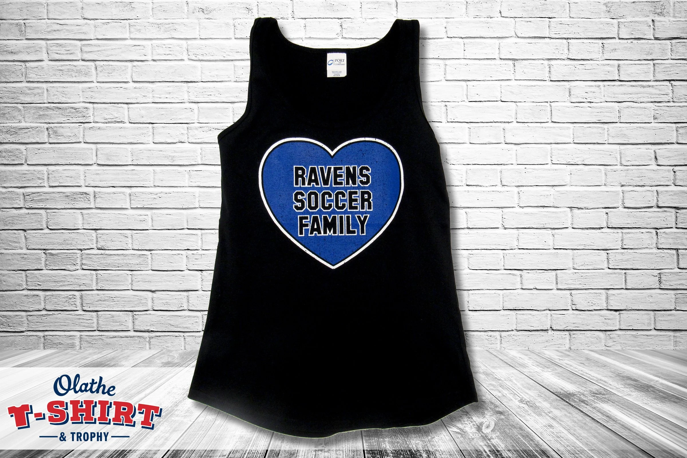 Blue long-sleeve women’s soccer shirt with a soccer-ball design and team lettering.