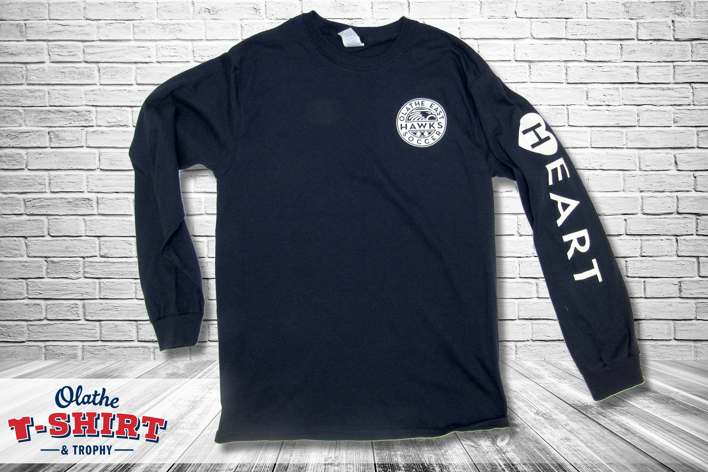 Front and back of gray theater shirts with lettering and classical column graphics.