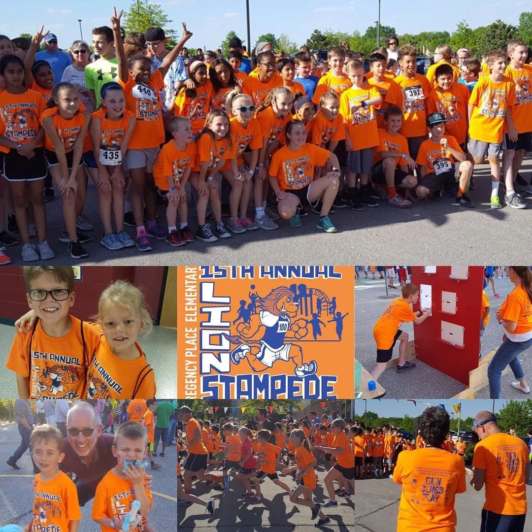 Children and adults wearing matching orange event shirts at an outdoor gathering.