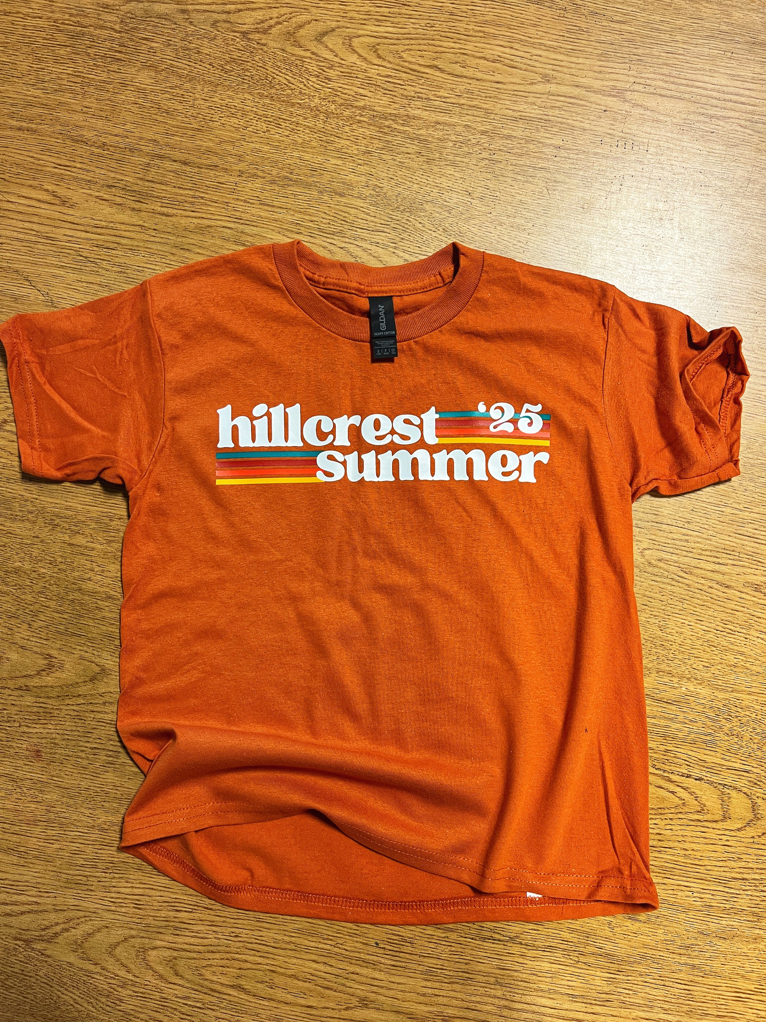 Orange T-shirt with a printed summer design.
