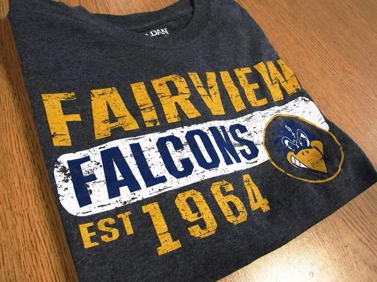Gray Falcons football shirt with yellow and blue graphics.